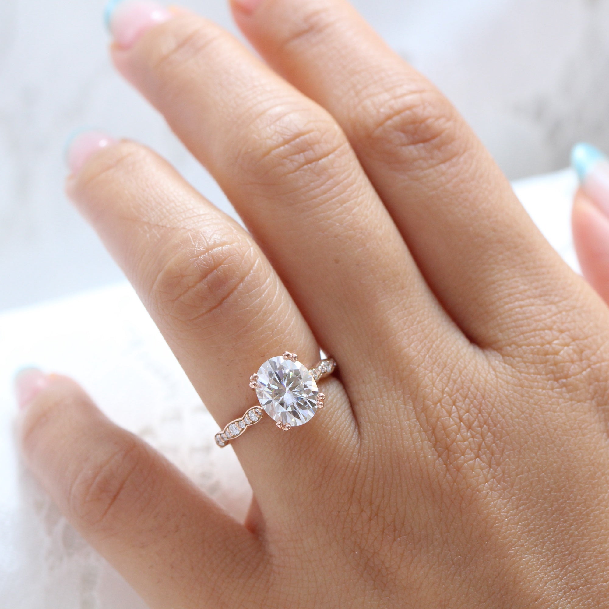 Oval solitaire deals moissanite engagement ring