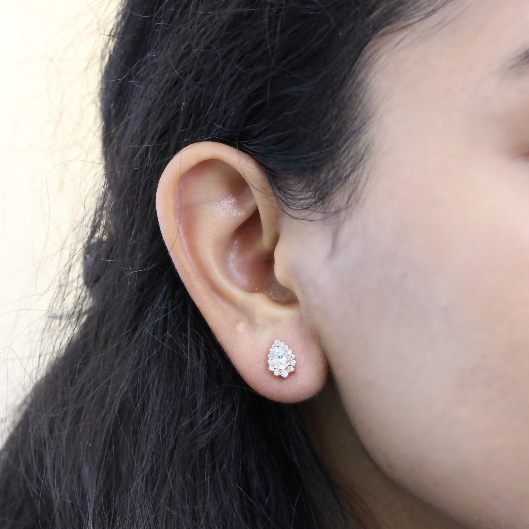 Half carat diamond online earrings on ear