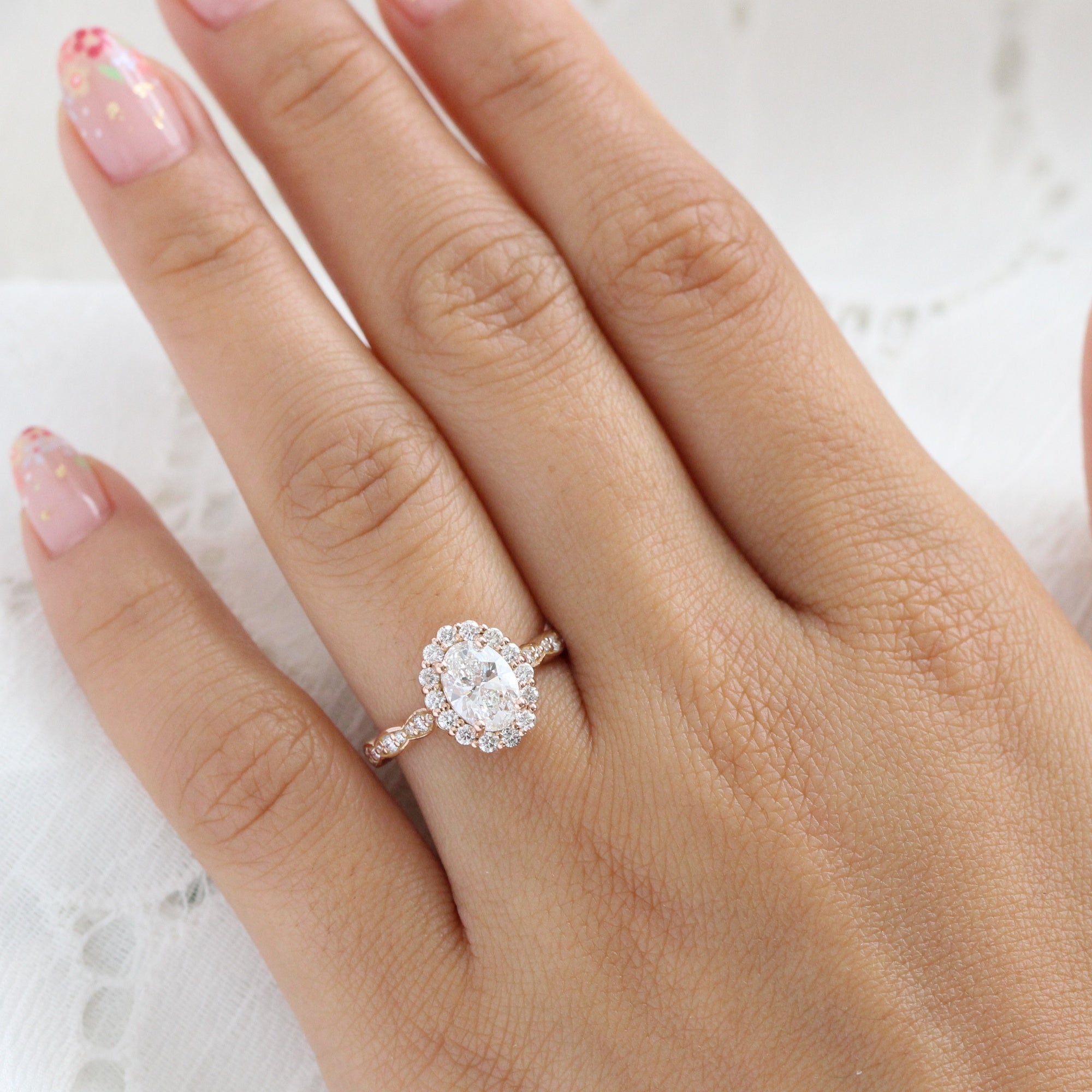 Oval halo engagement rings on deals finger