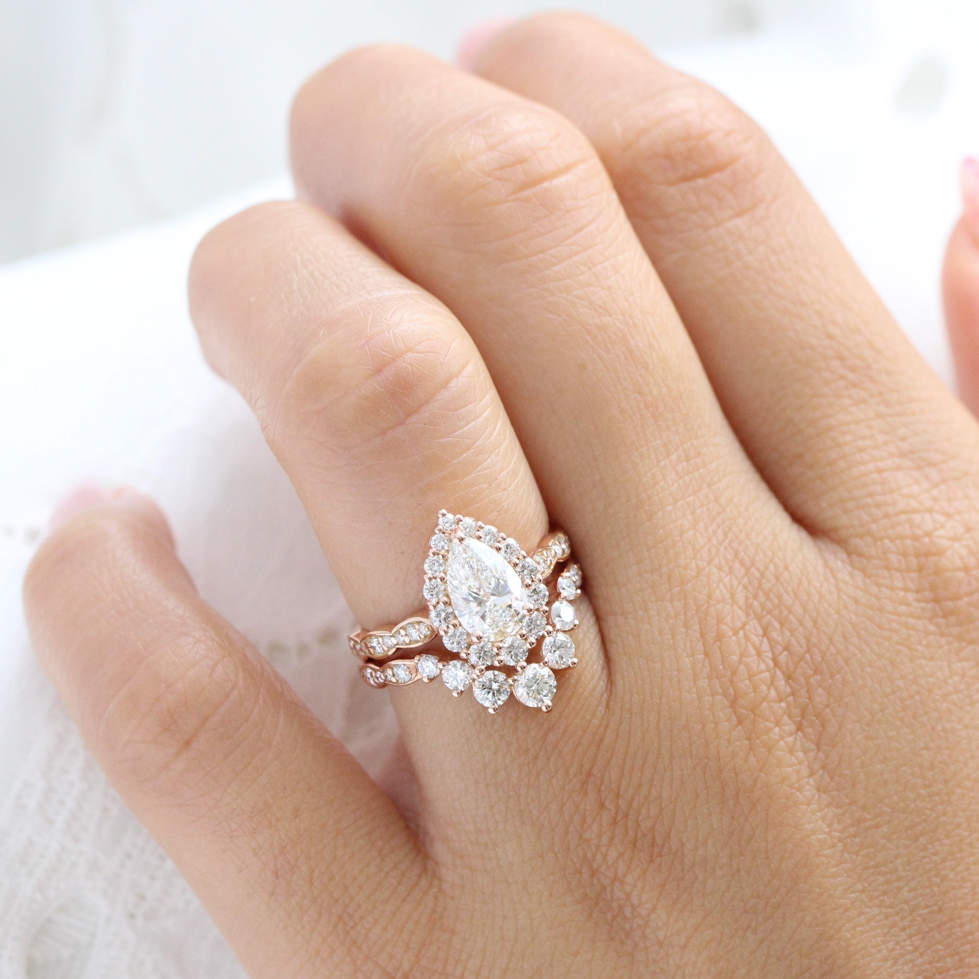 Pear shaped halo engagement on sale ring with wedding band