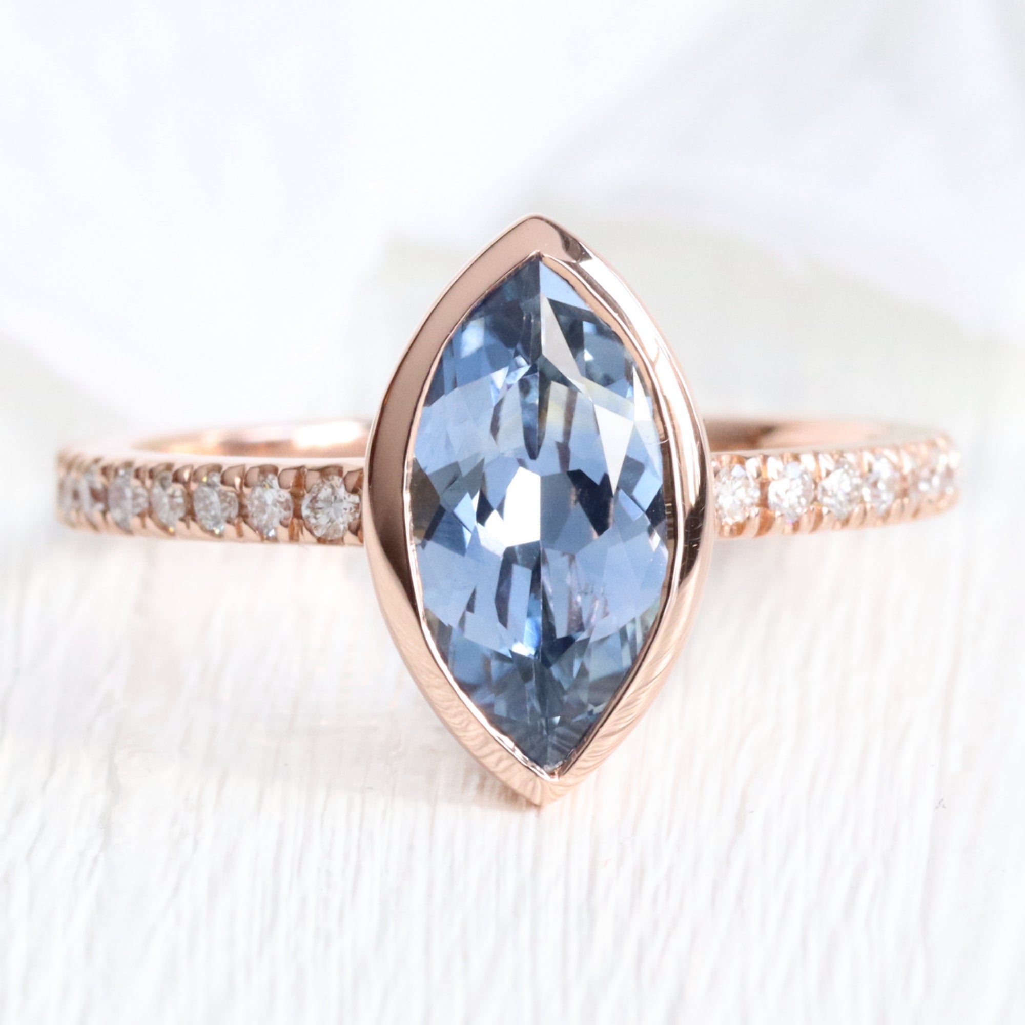 Marquise teal blue sapphire ring rose gold bezel solitaire pave diamond band la more design jewelry