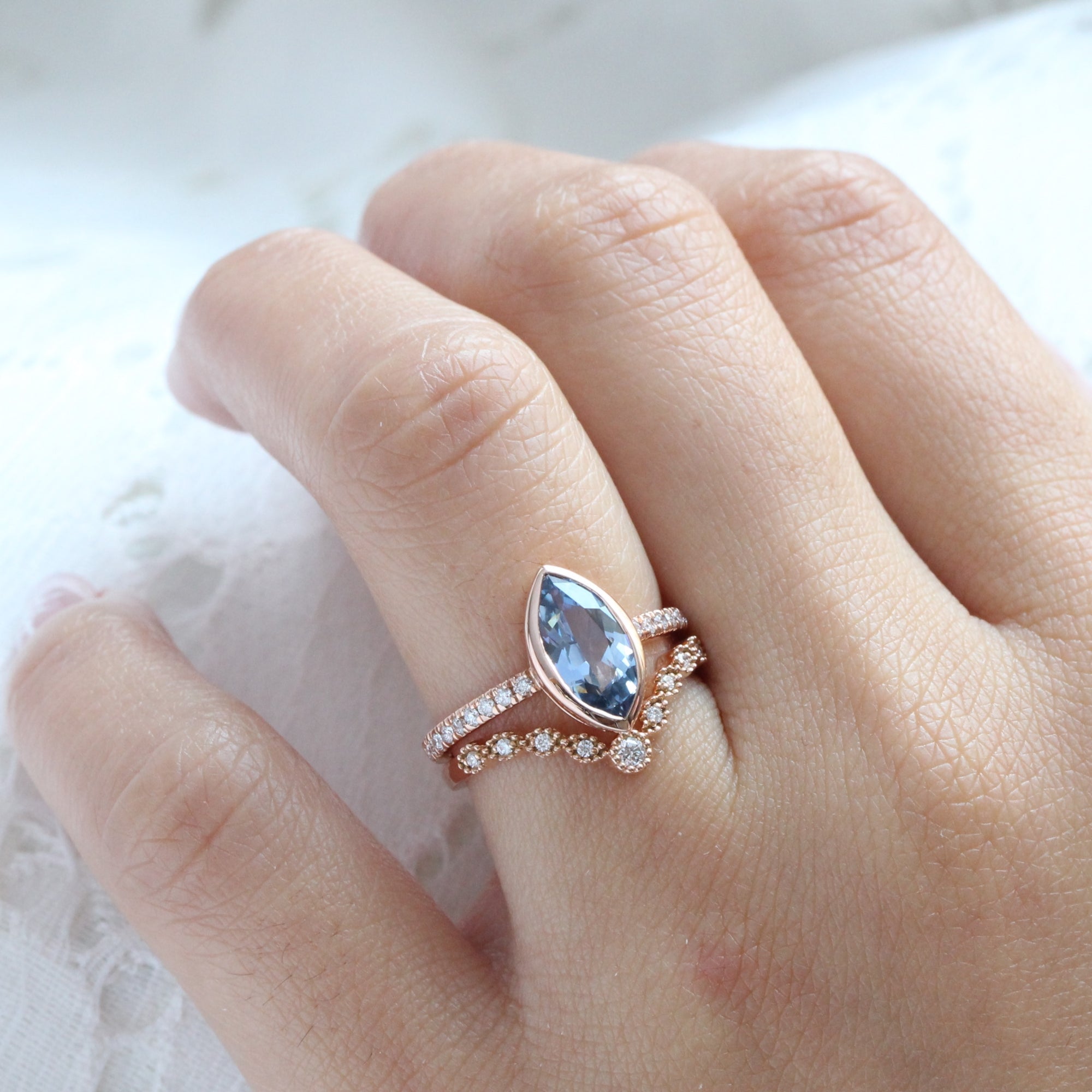 Marquise teal blue sapphire ring rose gold bezel solitaire pave diamond band la more design jewelry