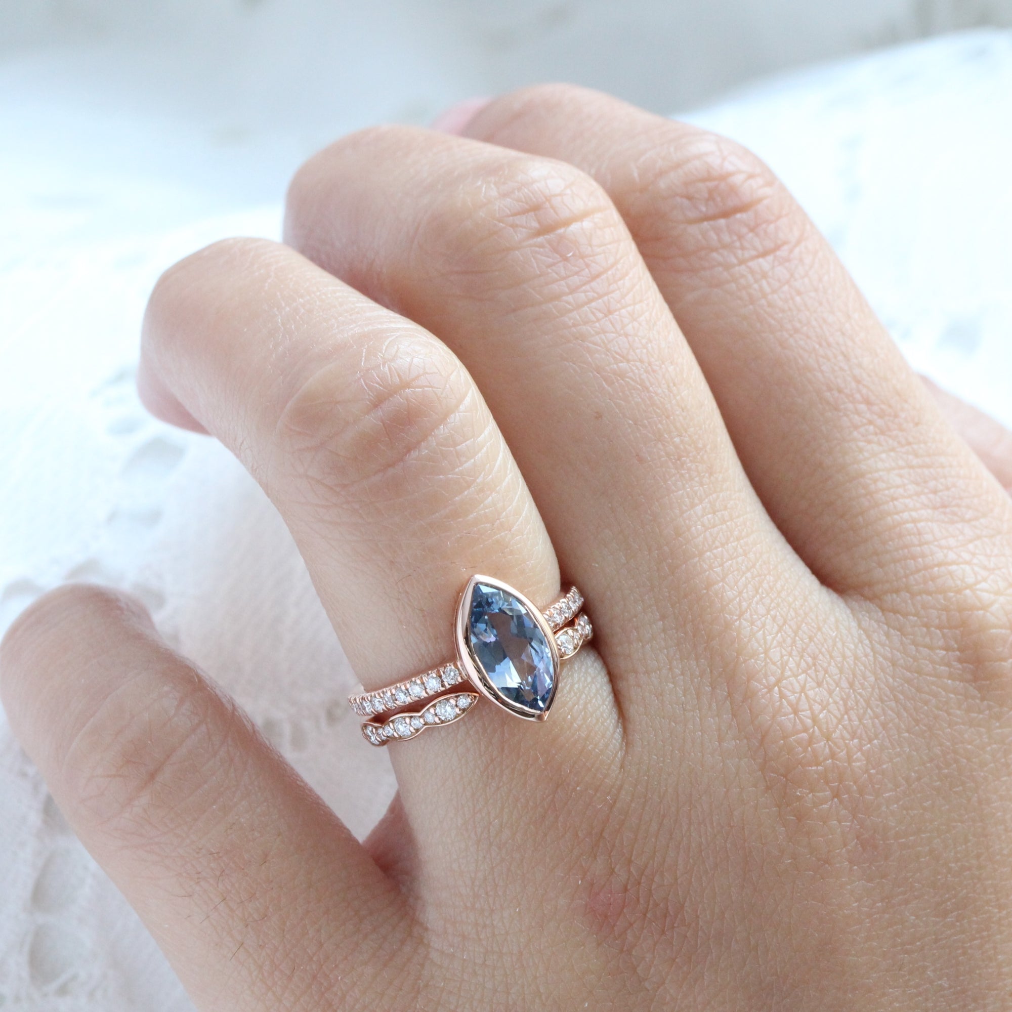 Marquise teal blue sapphire ring rose gold bezel solitaire pave diamond band la more design jewelry