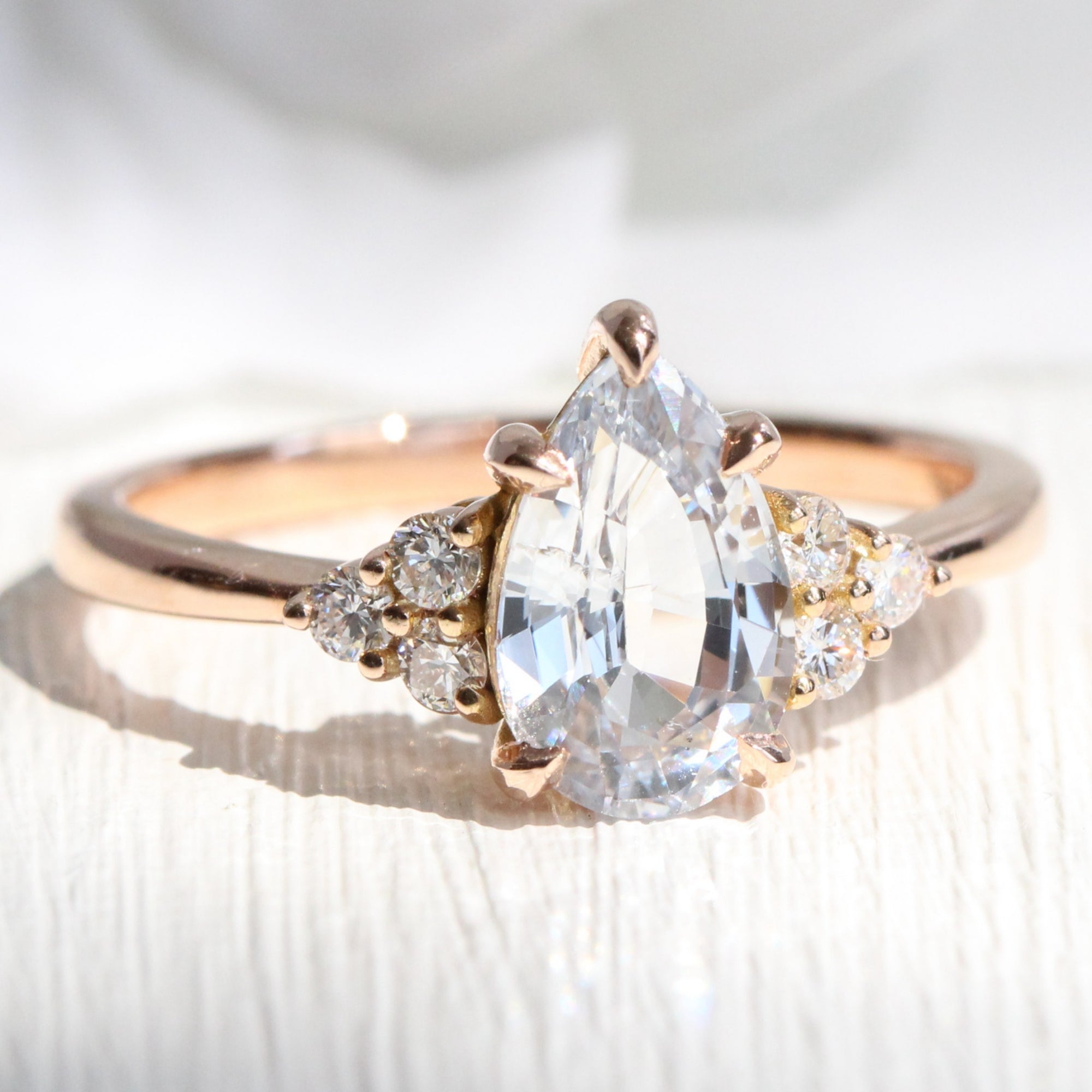 Pear cut white sapphire ring rose gold 3 stone diamond ring la more design jewelry