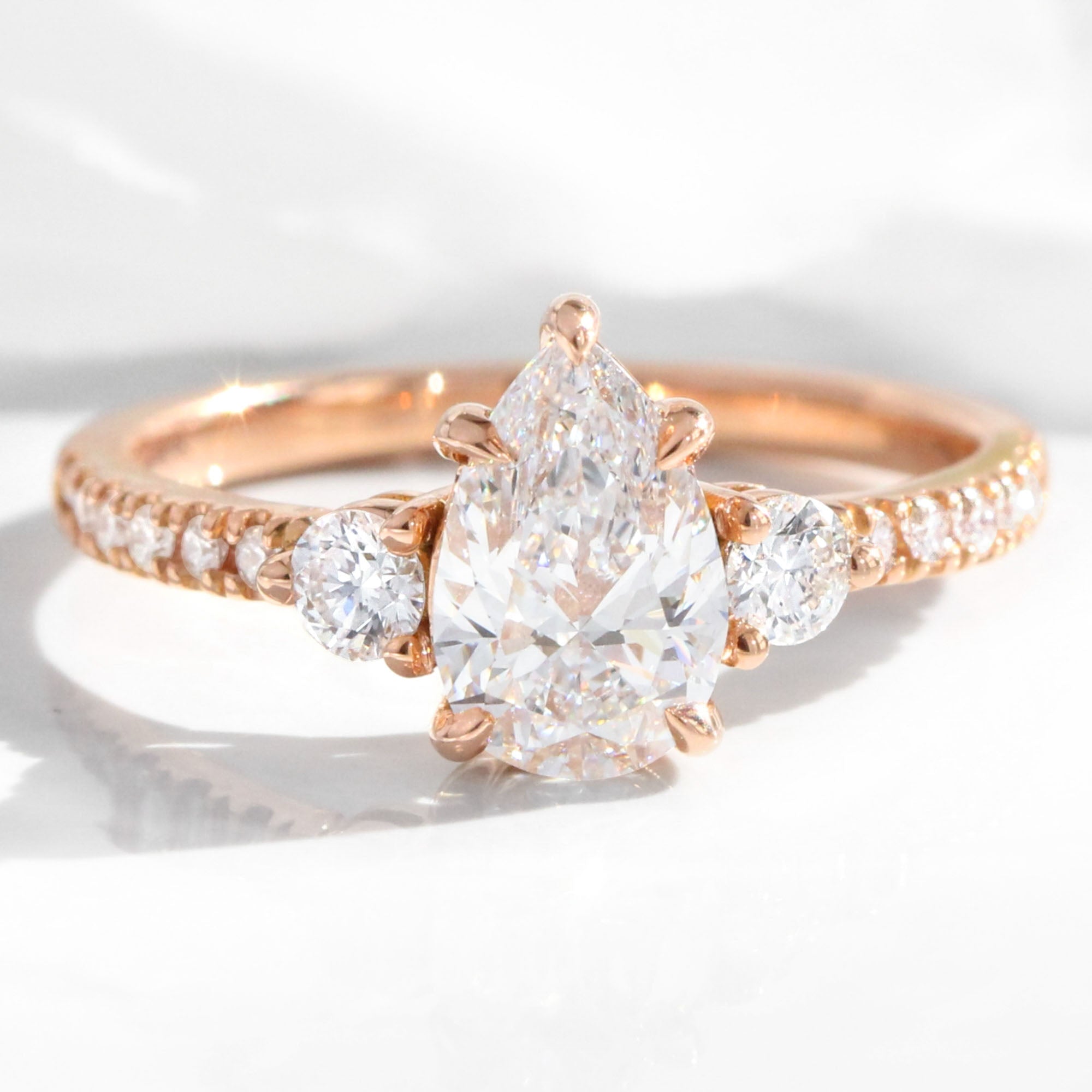 Pear lab diamond 3 stone engagement ring rose gold cluster pave ring la more design jewelry