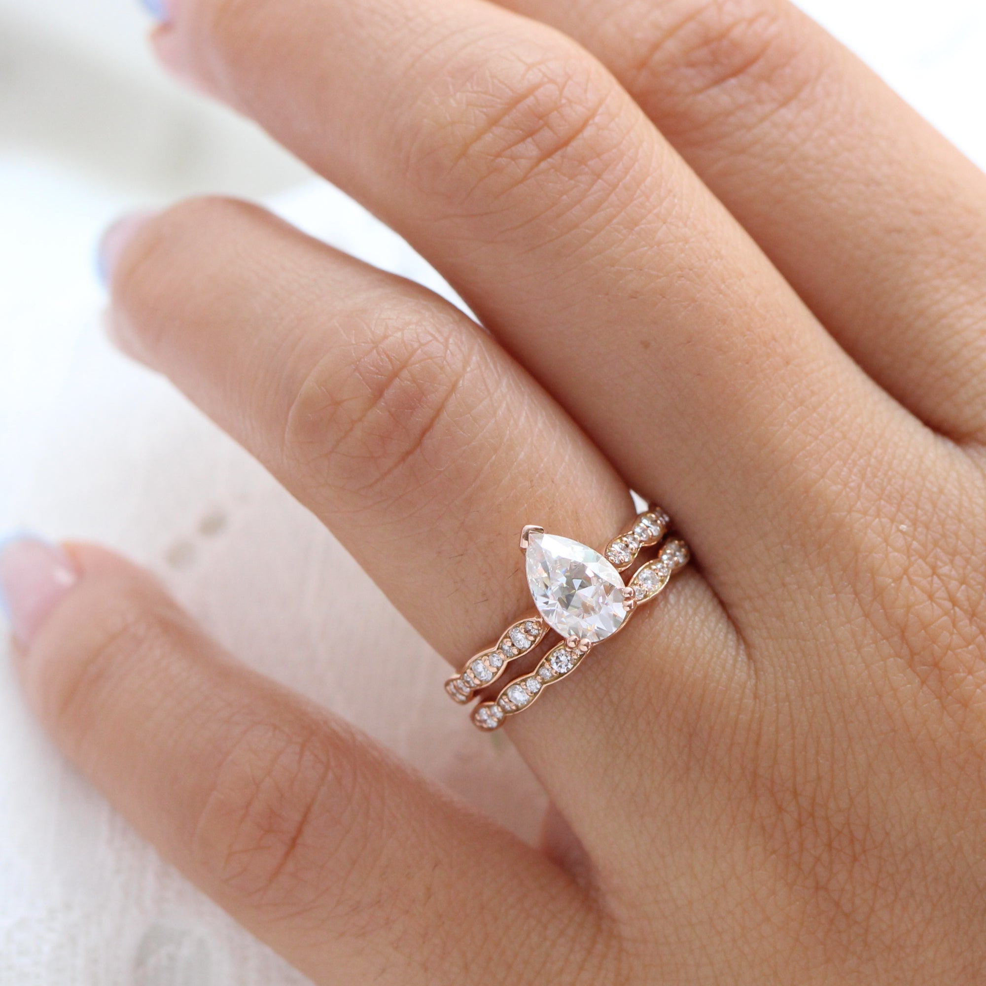 Pear moissanite diamond solitaire ring rose gold matching diamond wedding band la more design jewelry