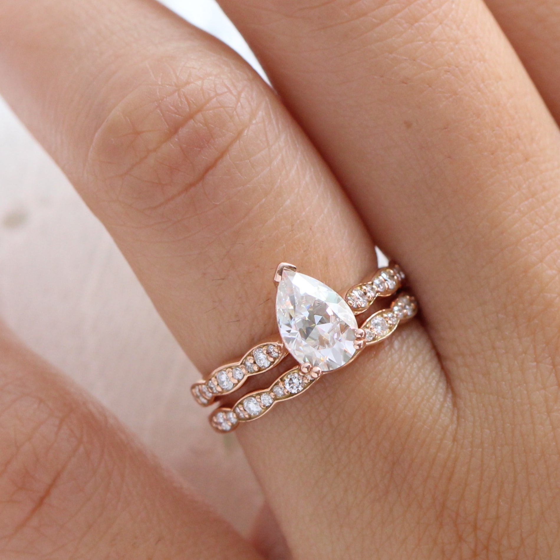 Pear moissanite diamond solitaire ring rose gold matching diamond wedding band la more design jewelry