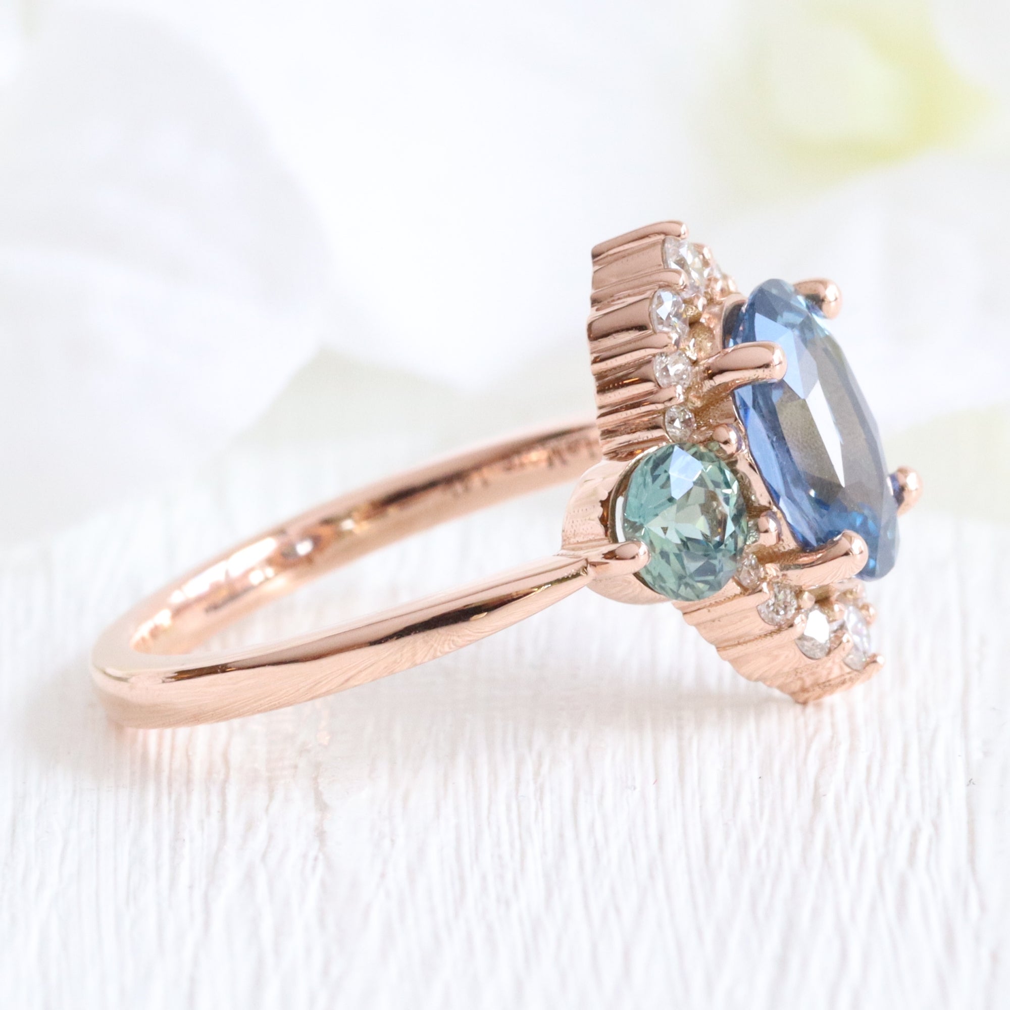 Unique teal blue sapphire ring rose gold diamond halo 3 stone ring la more design jewelry