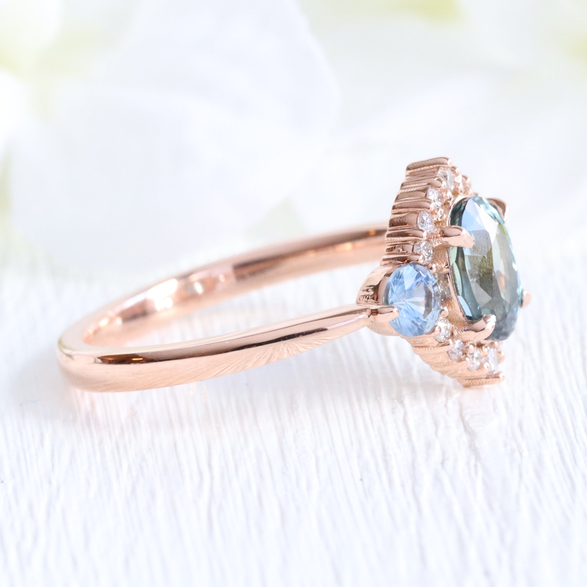 Unique teal blue sapphire ring rose gold diamond halo 3 stone ring la more design jewelry