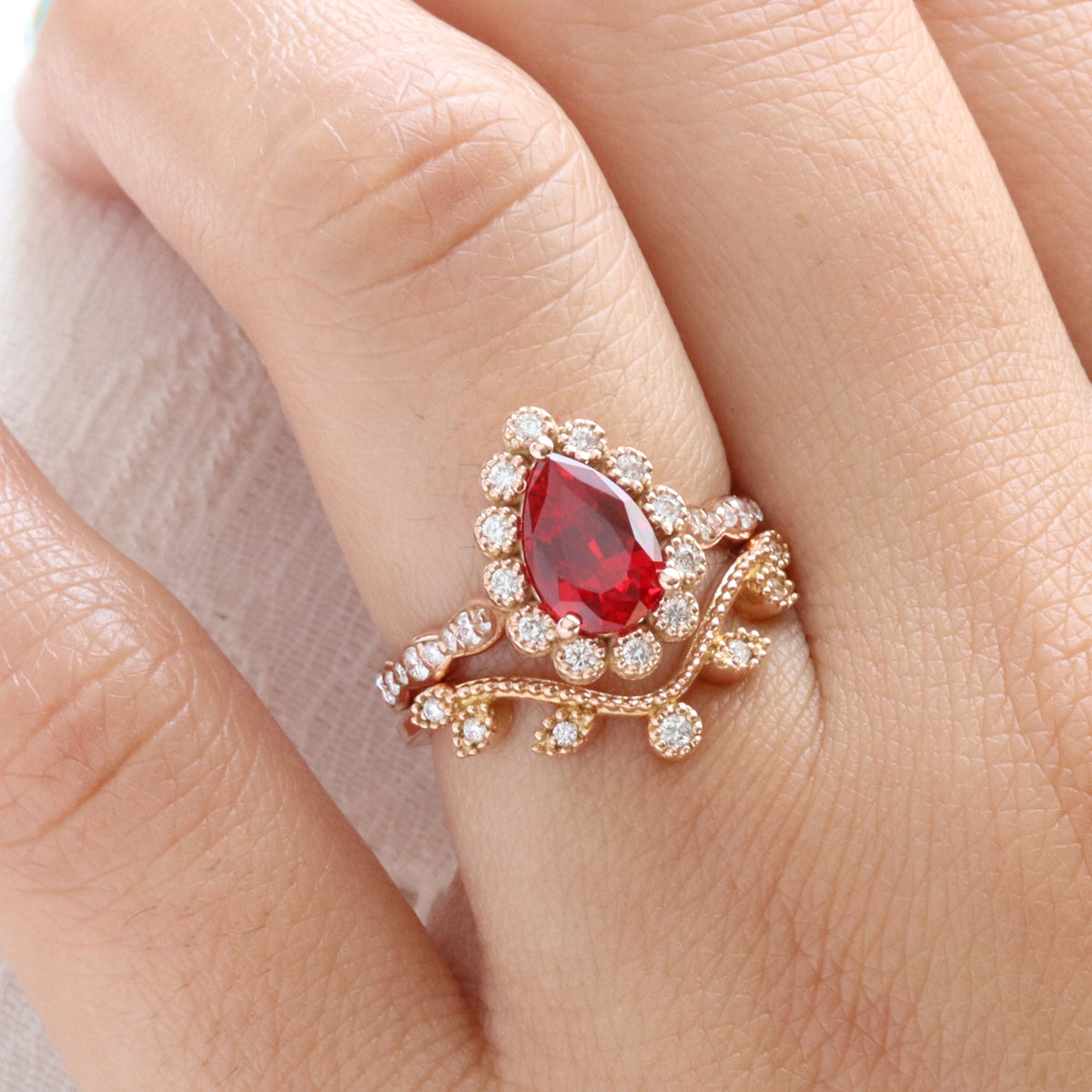 Vintage style pear ruby ring bridal set rose gold curved leaf diamond wedding ring stack la more design jewelry