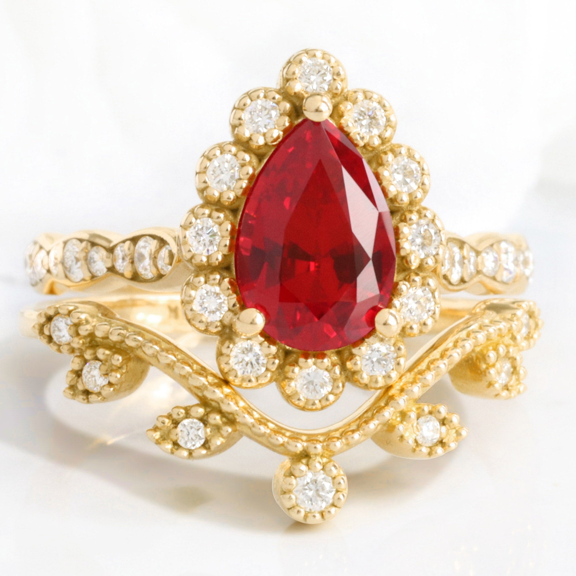 Vintage style pear ruby ring bridal set yellow gold curved leaf diamond wedding ring stack la more design jewelry