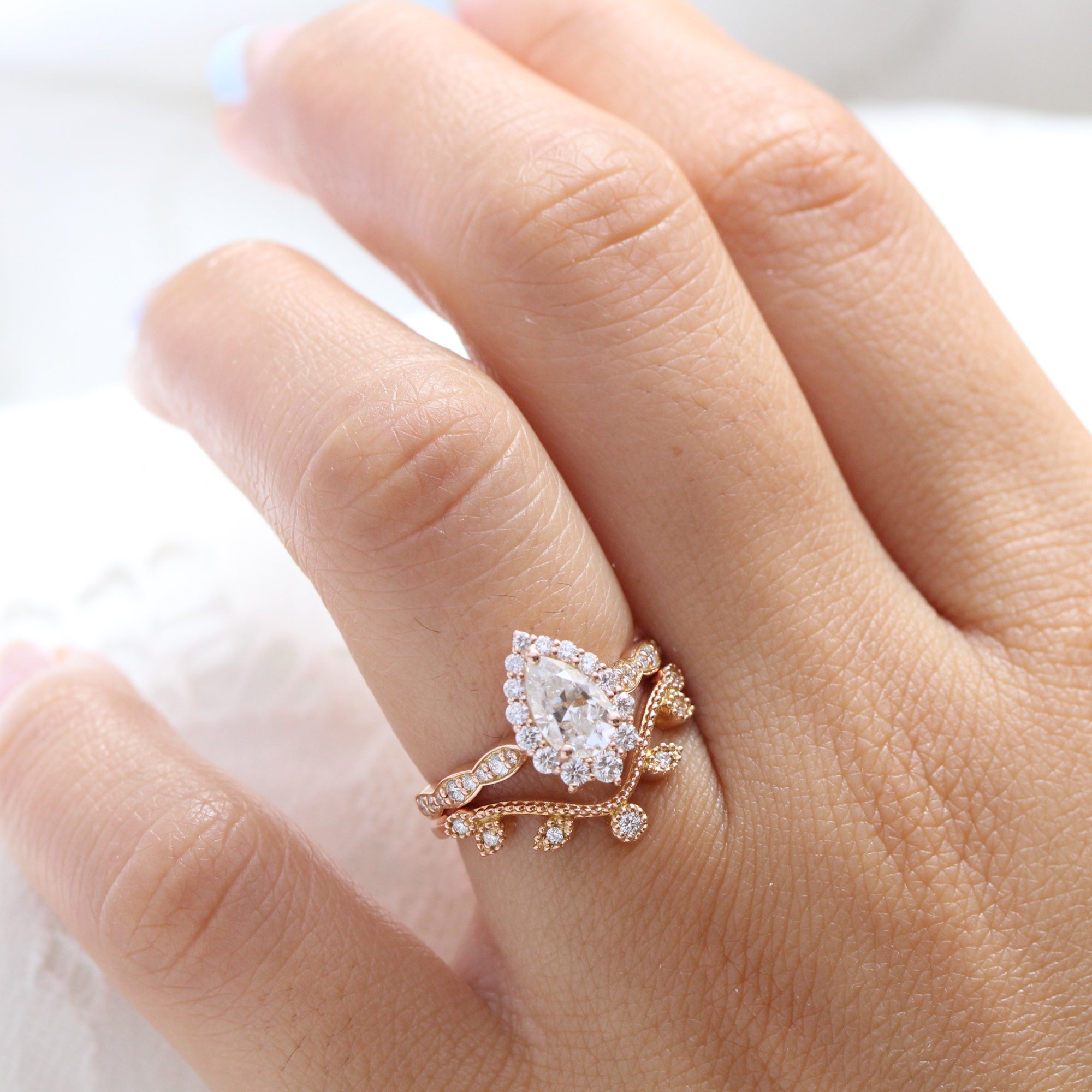 halo pear moissanite engagement ring and curved diamond wedding band la more design jewelry