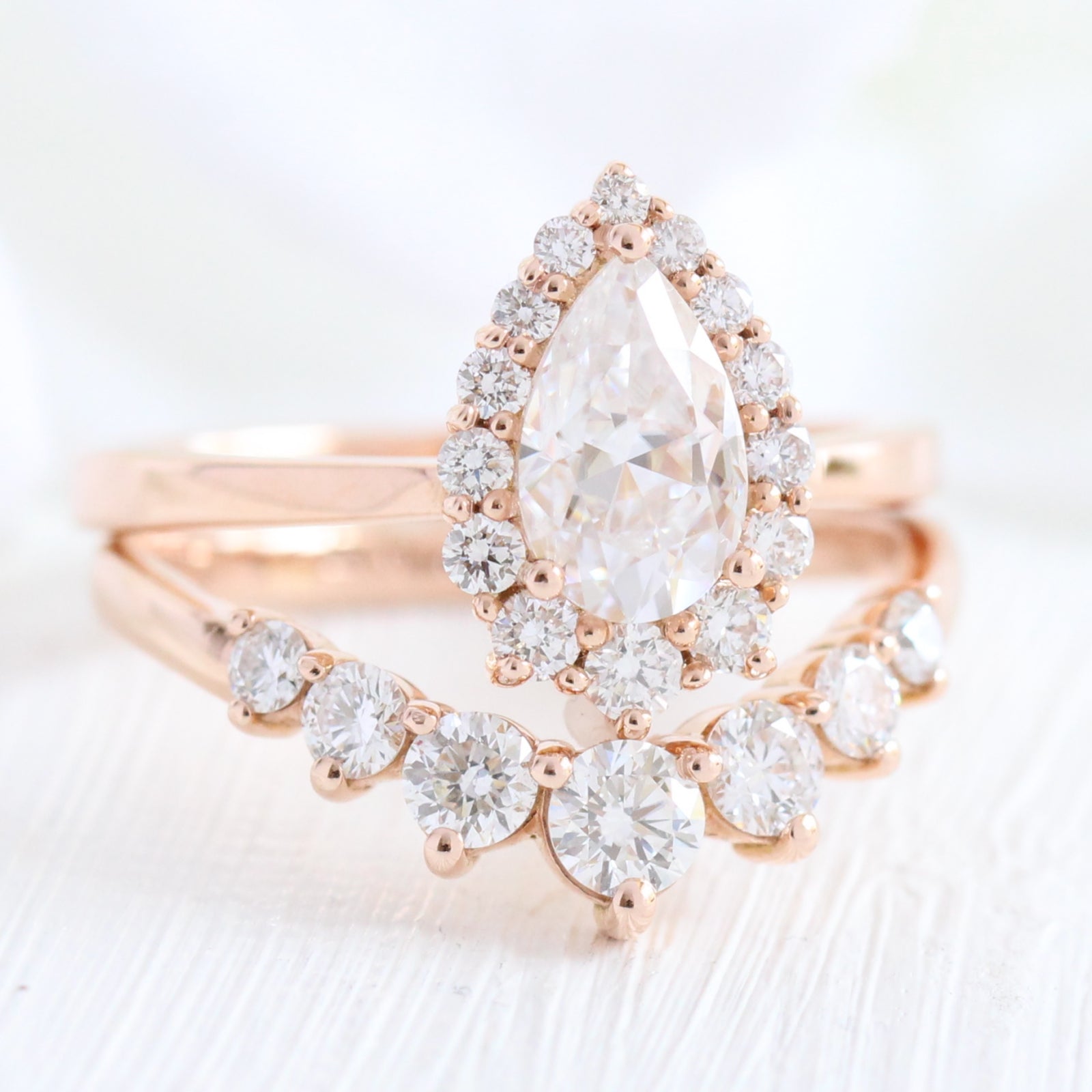 pear moissanite halo diamond engagement ring rose gold and large diamond wedding band by la more design jewelry