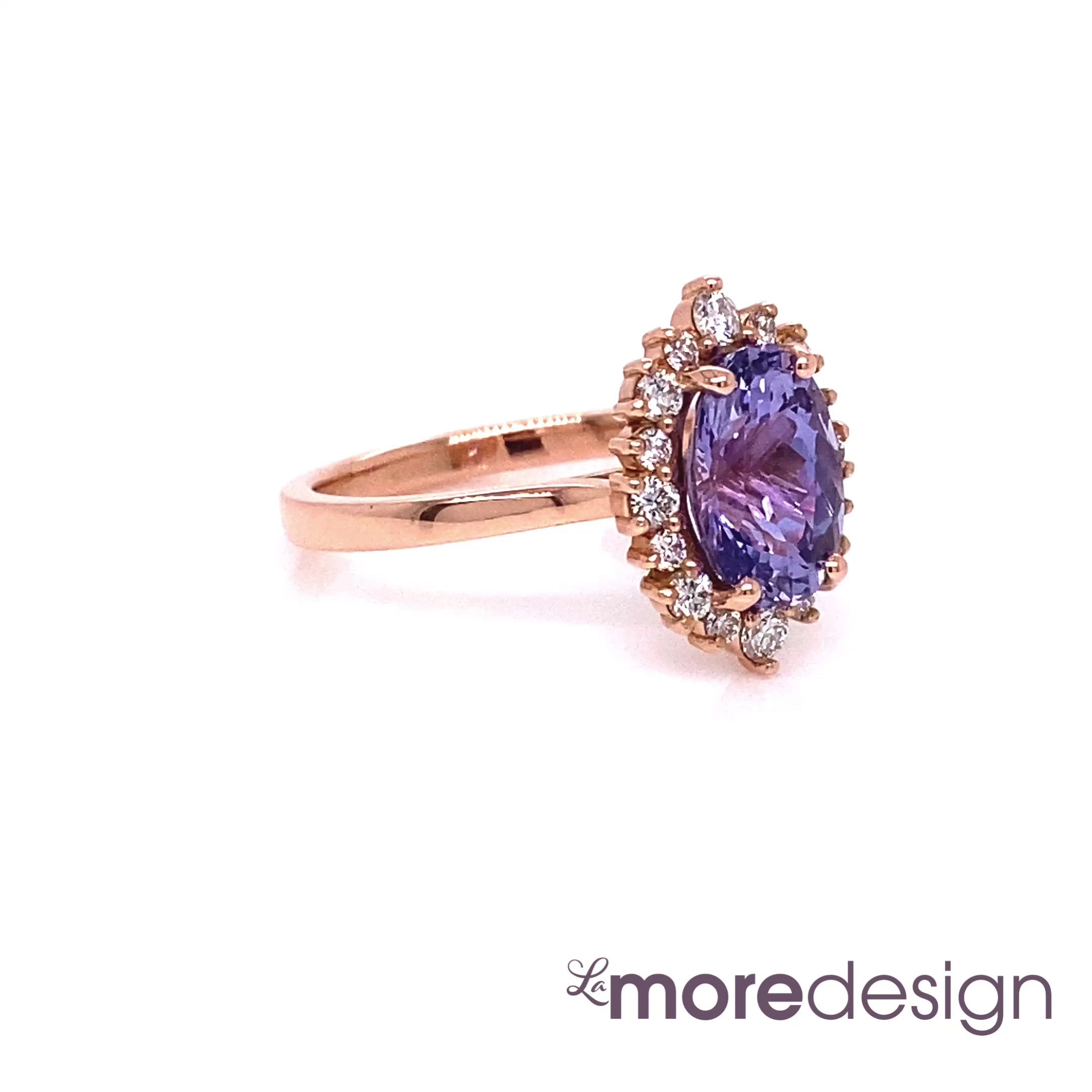 Stunningly unique purple sapphire engagement ring is crafted in a 14k rose gold Tiara Halo Diamond ring setting with a large 2.57-carat oval cut natural sapphire center ~ the total gemstone and diamond weight of the whole ring is 2.95 ct.tw.  This one-of-a-kind sapphire ring is perfect for brides looking for non-traditional engagement rings. All our wedding bands can pair beautifully with this gorgeous halo diamond sapphire ring!