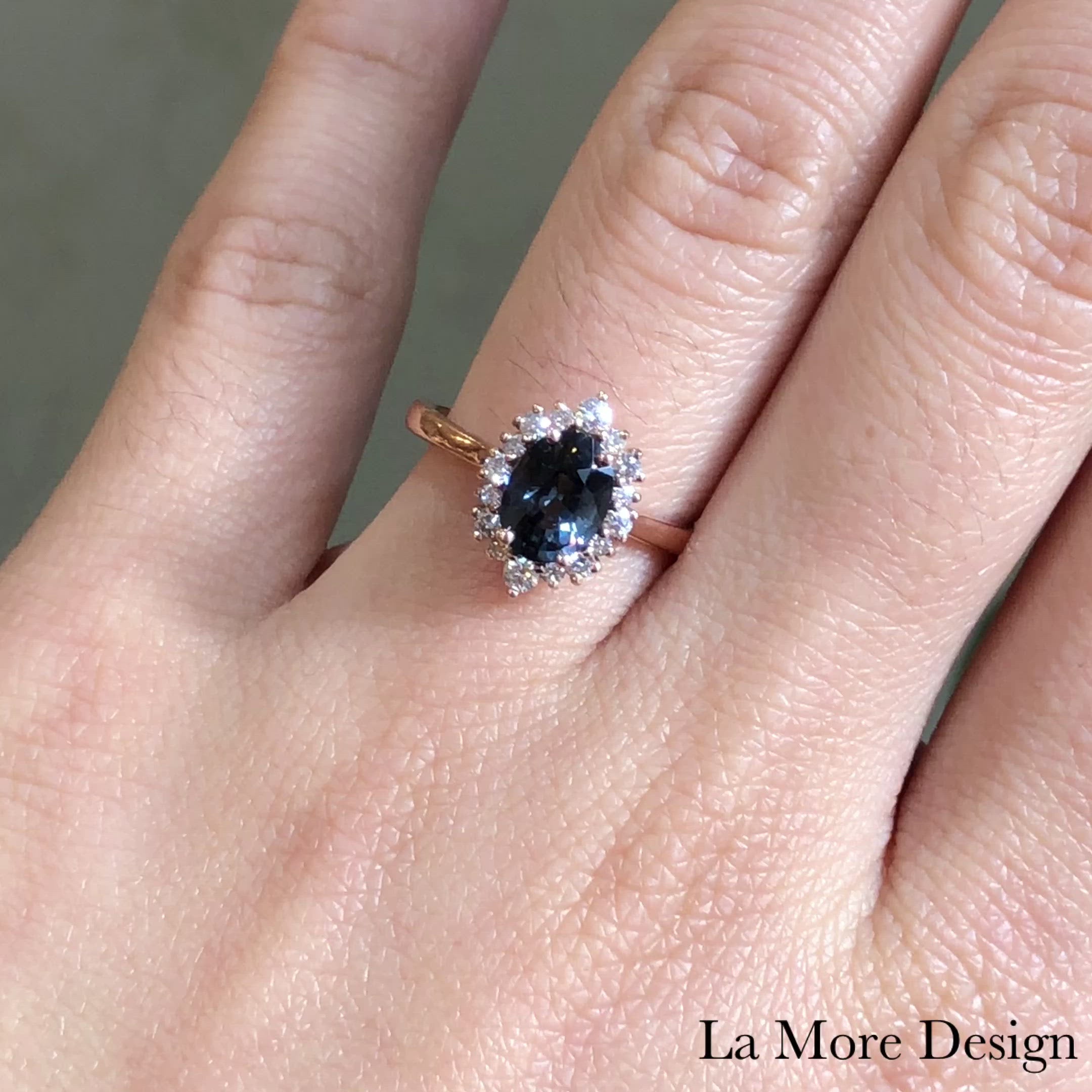 Elegant yet unique grey spinel diamond engagement ring is crafted in a 14k rose gold tiara halo diamond ring setting featuring a 1.33-carat oval cut natural grey spinel center encircled by a halo of brilliant white diamonds to create the truly one of a kind look ~ the total gemstone and diamond weight of the whole ring is 1.63 ct.tw.  