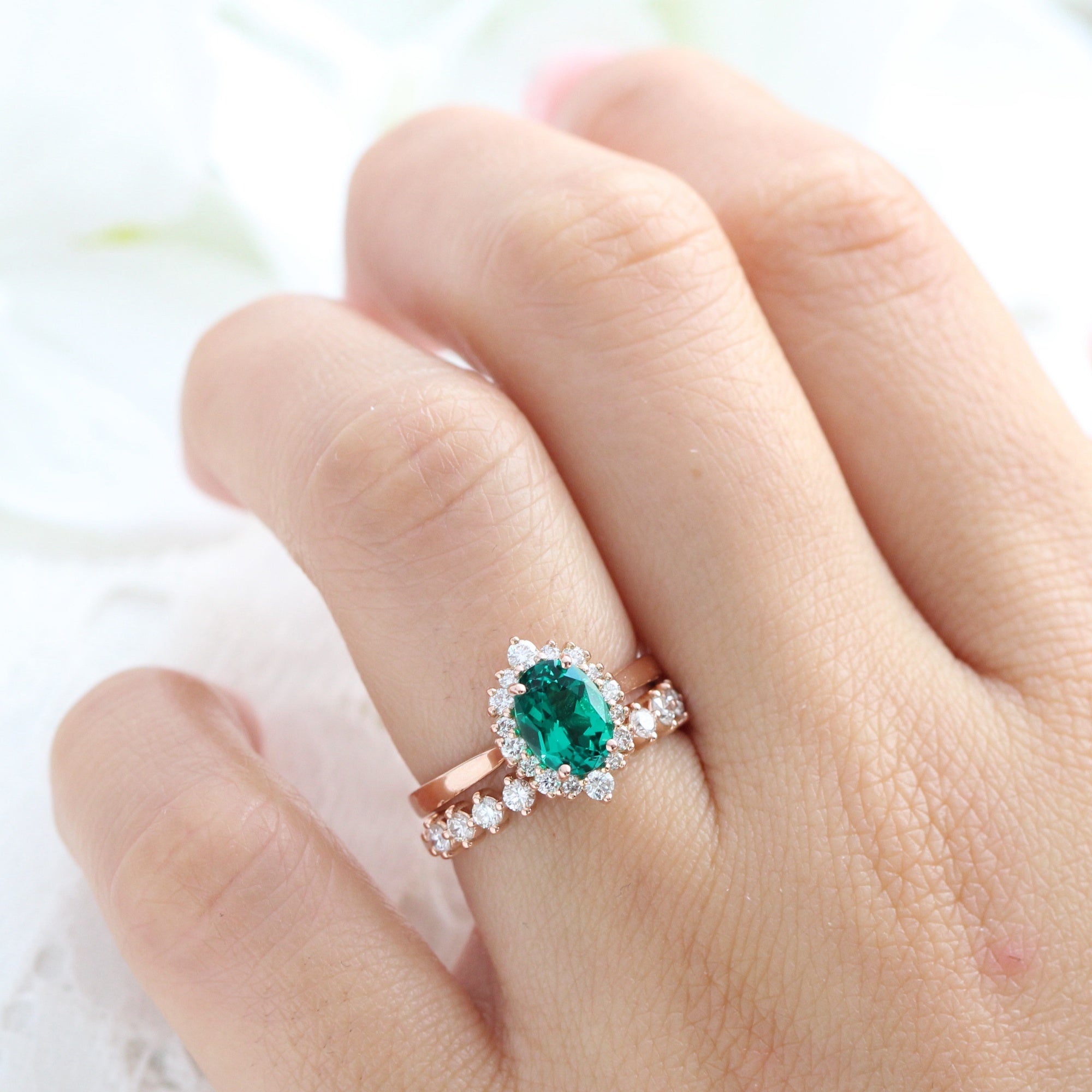 Emerald surrounded sale by diamonds ring