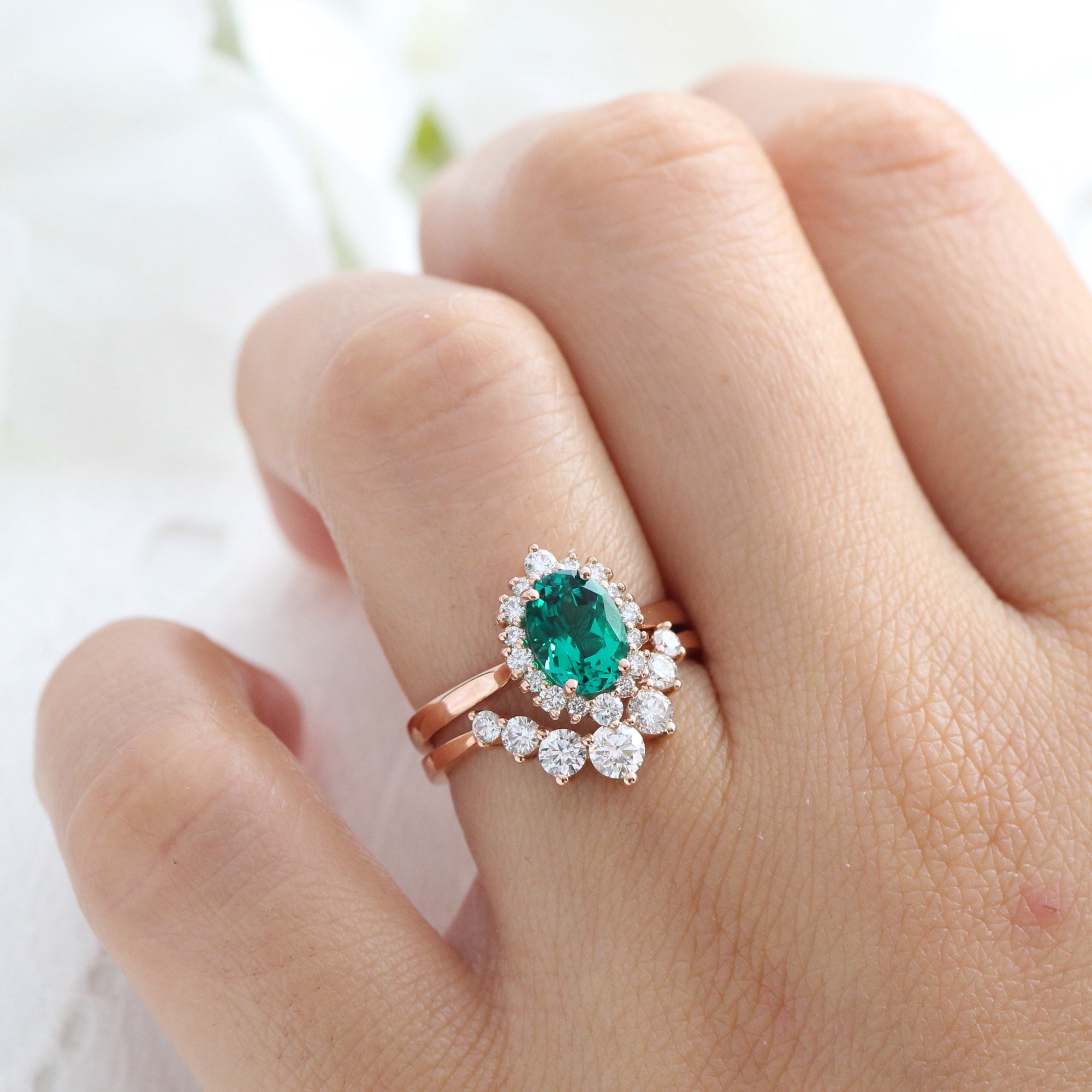 Emerald ring store diamond halo