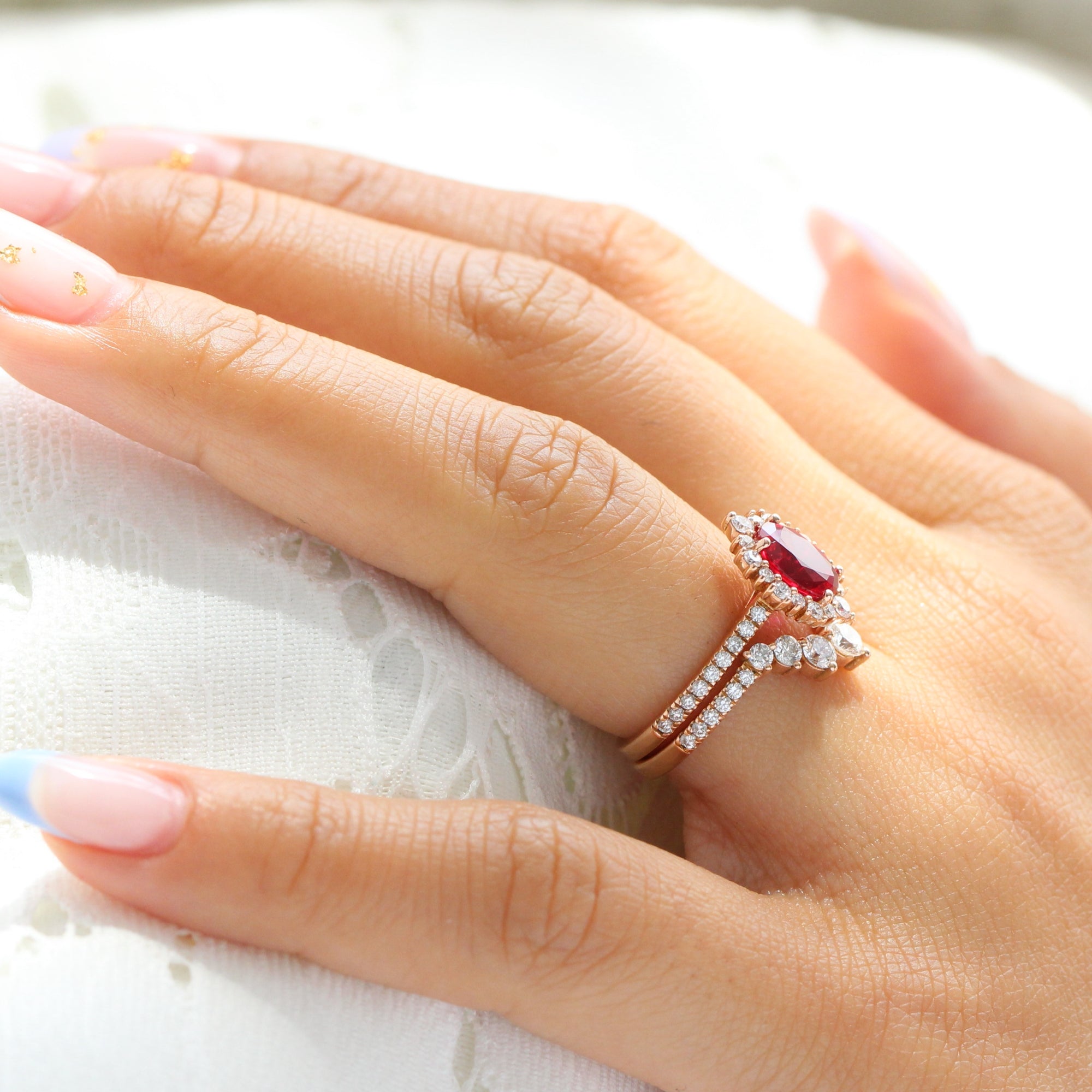 Halo diamond oval ruby ring stack rose gold U curved diamond wedding band la more design jewelry