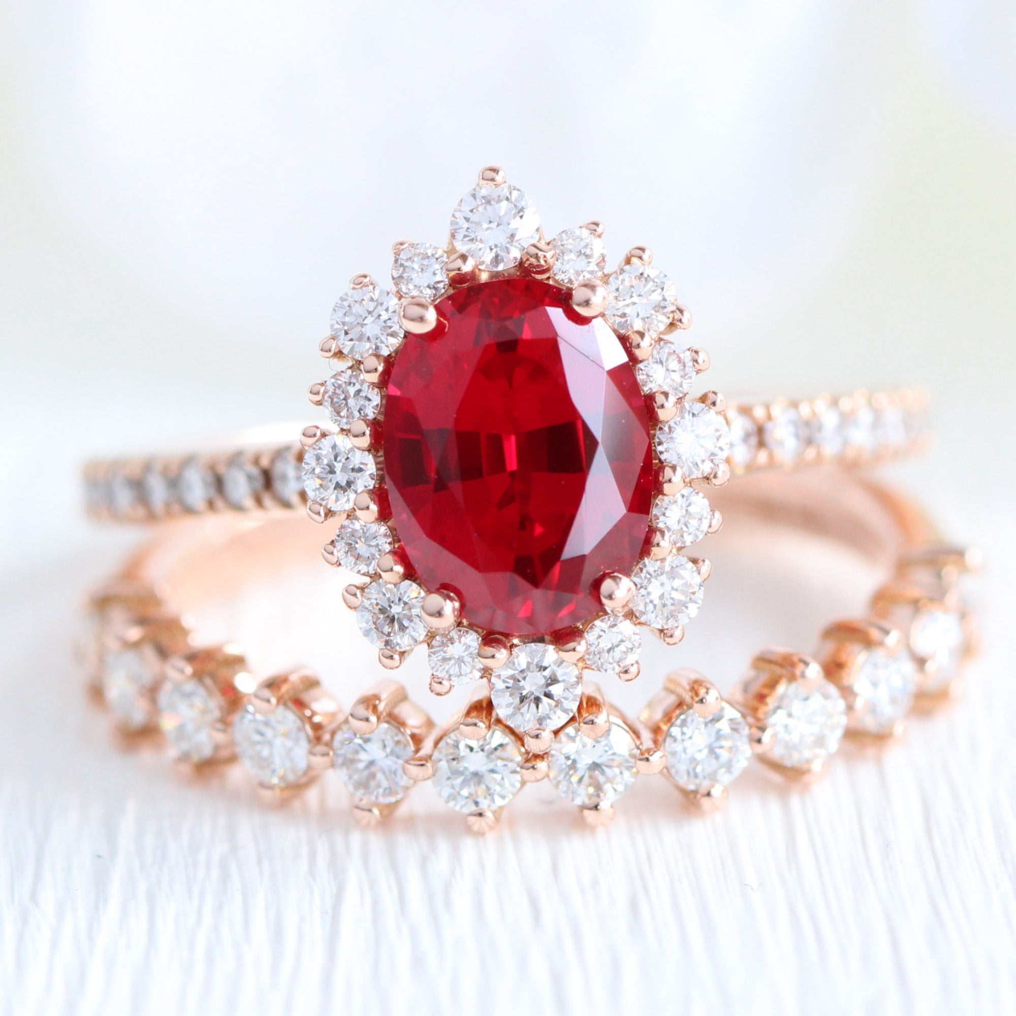 Halo diamond oval ruby ring stack rose gold eternity diamond wedding band la more design jewelry