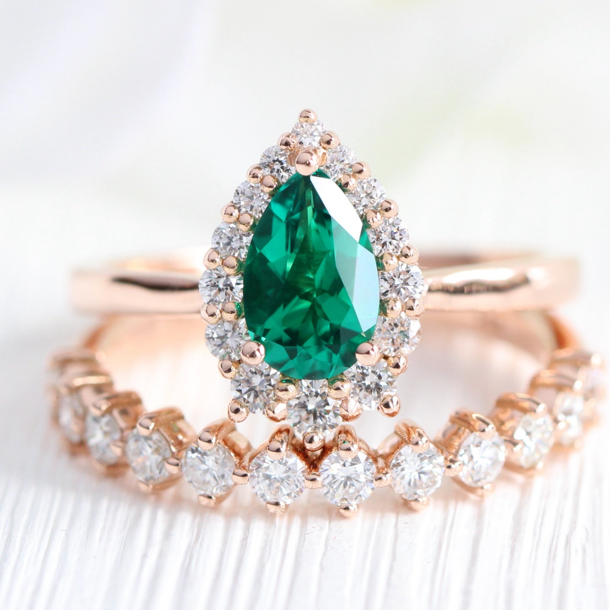 Halo diamond pear emerald ring stock rose gold half eternity wedding band la more design jewelry