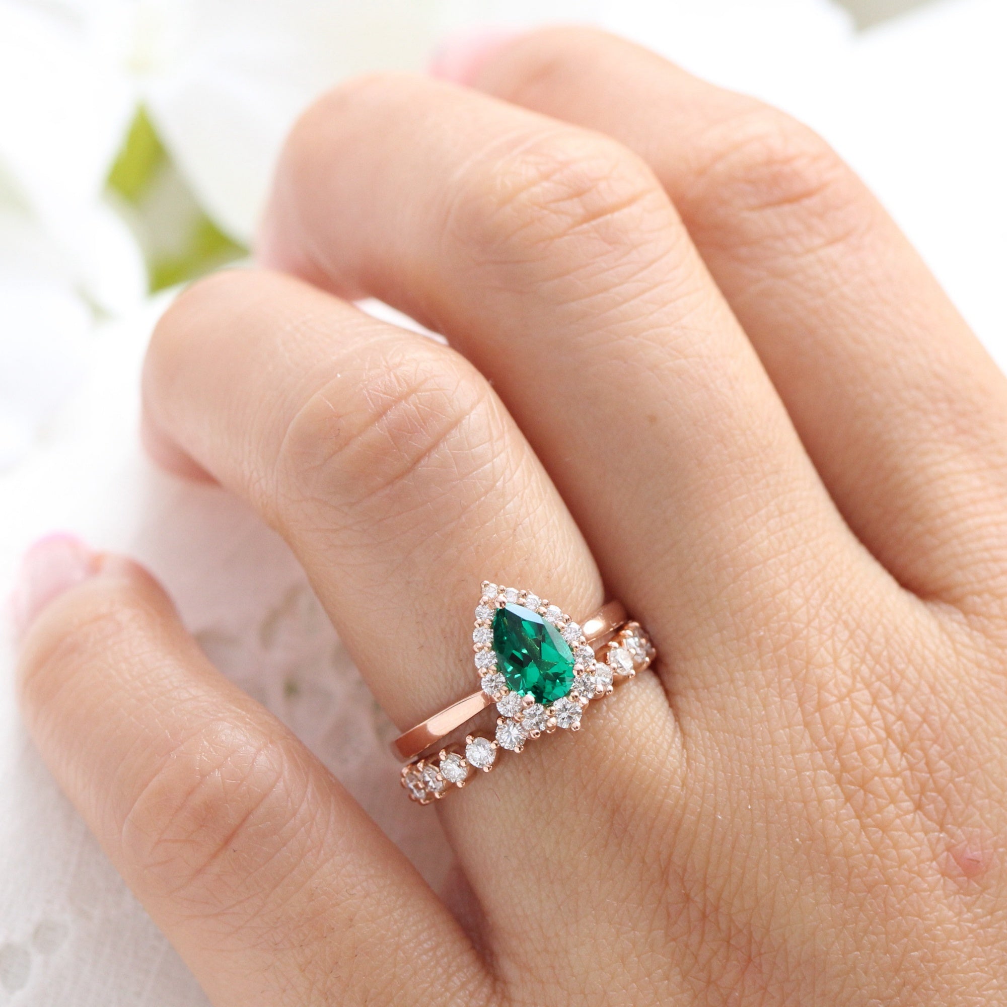 Halo diamond pear emerald ring stock rose gold half eternity wedding band la more design jewelry