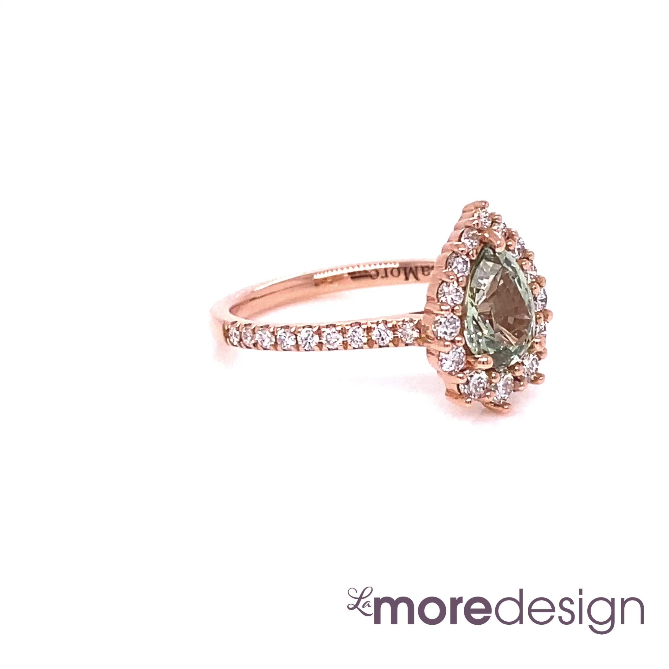 This timelessly gorgeous yet unique green sapphire engagement ring is crafted in 14k rose gold Tiara Halo Diamond ring setting with a 0.98-carat pear cut natural sea-foam green sapphire center ~ total gemstone and diamond weight of the whole ring is 1.54 ct.tw.  This one-of-a-kind sapphire diamond ring is perfect for brides looking for diamond alternative engagement rings! All our wedding bands can pair beautifully with this gorgeous halo diamond sapphire ring!