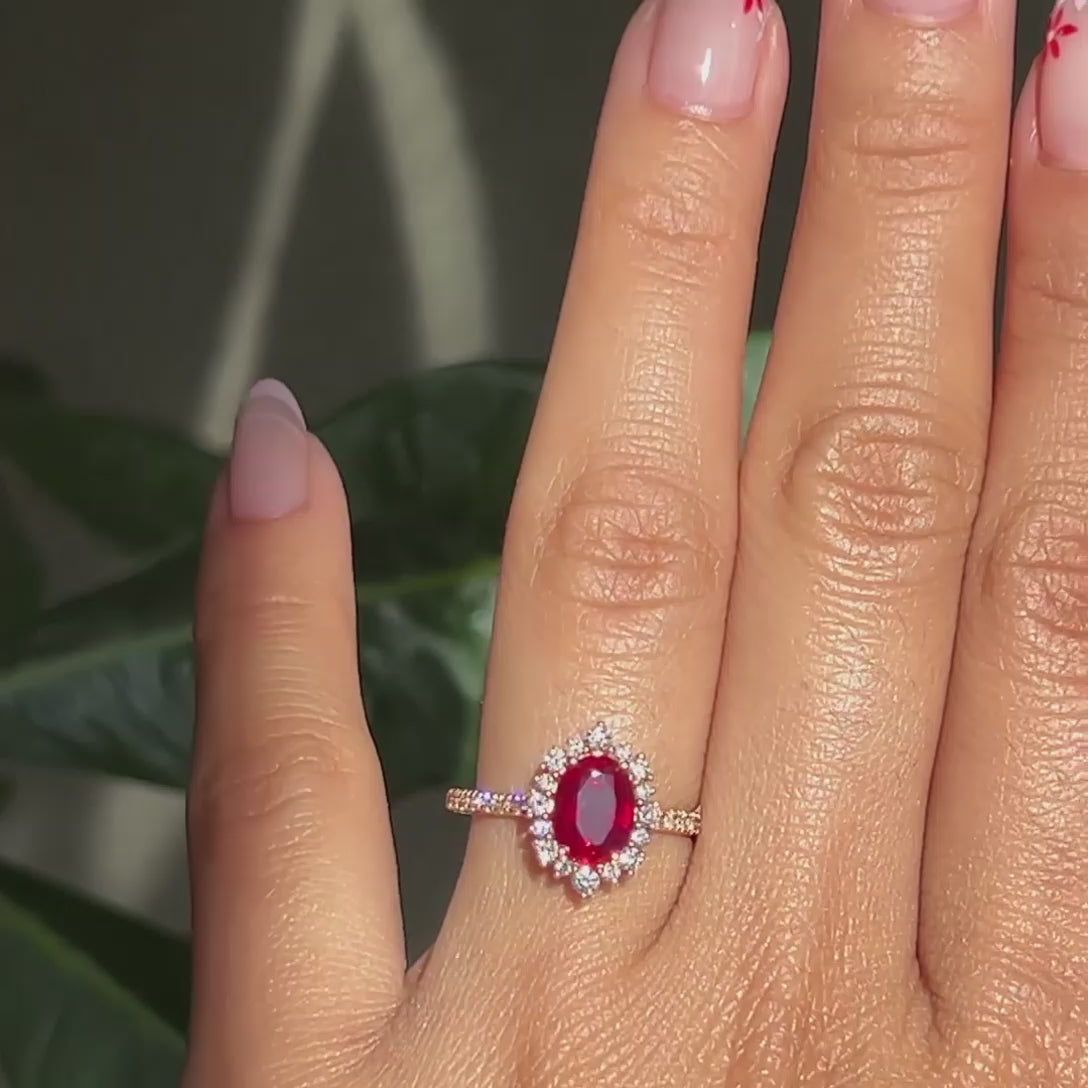 Oval ruby halo on sale ring