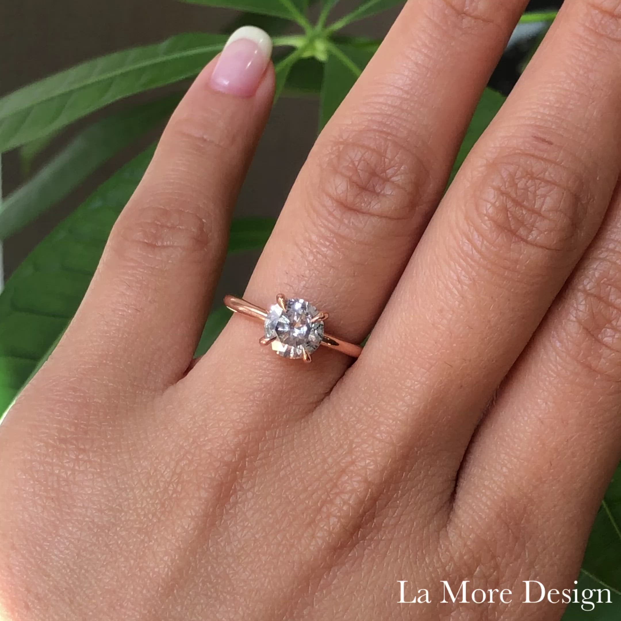 This stunningly gorgeous grey diamond engagement ring features a large 1.81 carat round cut natural salt and pepper diamond set in a 14k rose gold flat set low profile solitaire ring setting that lays flat perfectly on top of your finger for comfortable wear. Adore your love with this large diamond ring today!