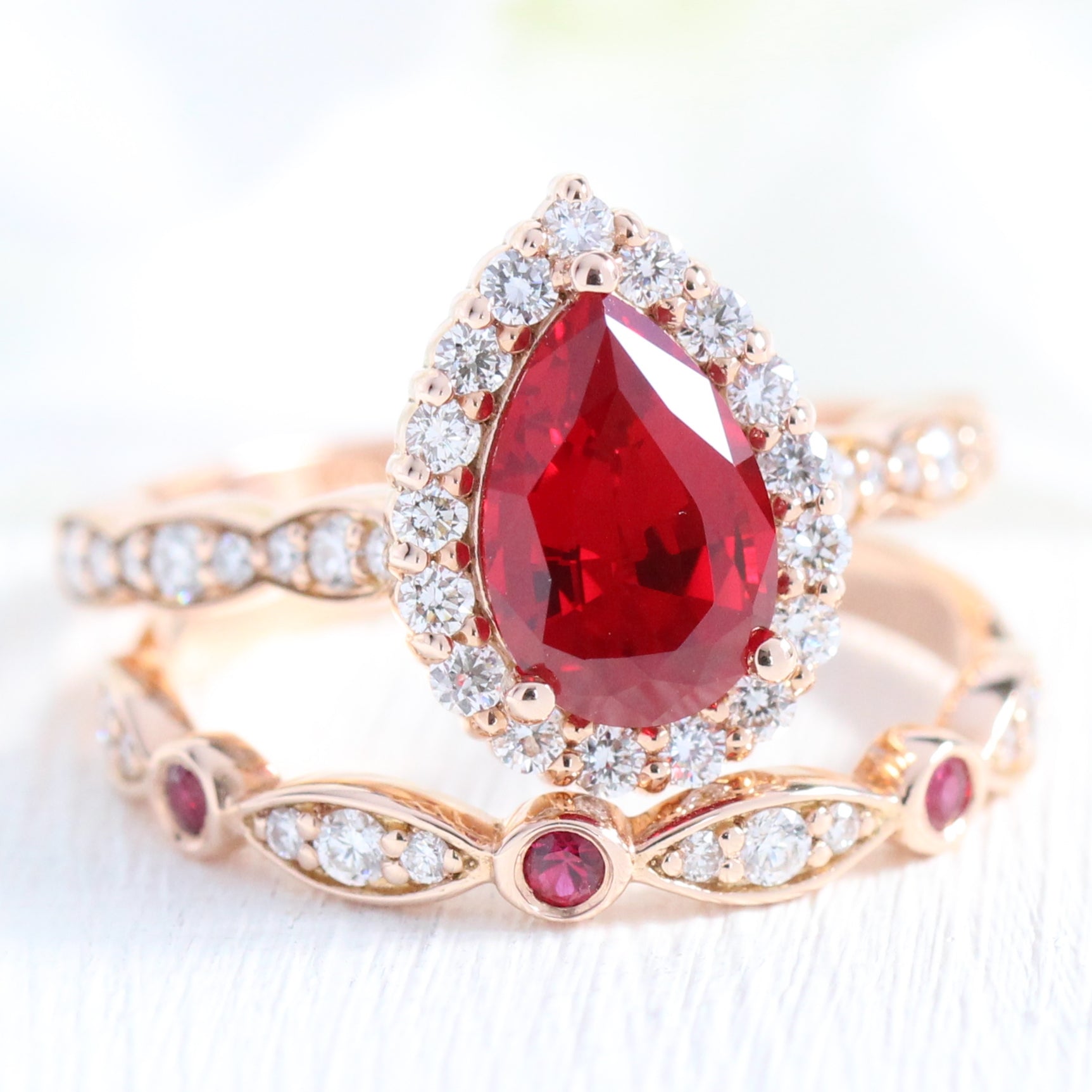 halo diamond pear ruby engagement ring rose gold bridal set ruby diamond wedding band by la more design jewelry