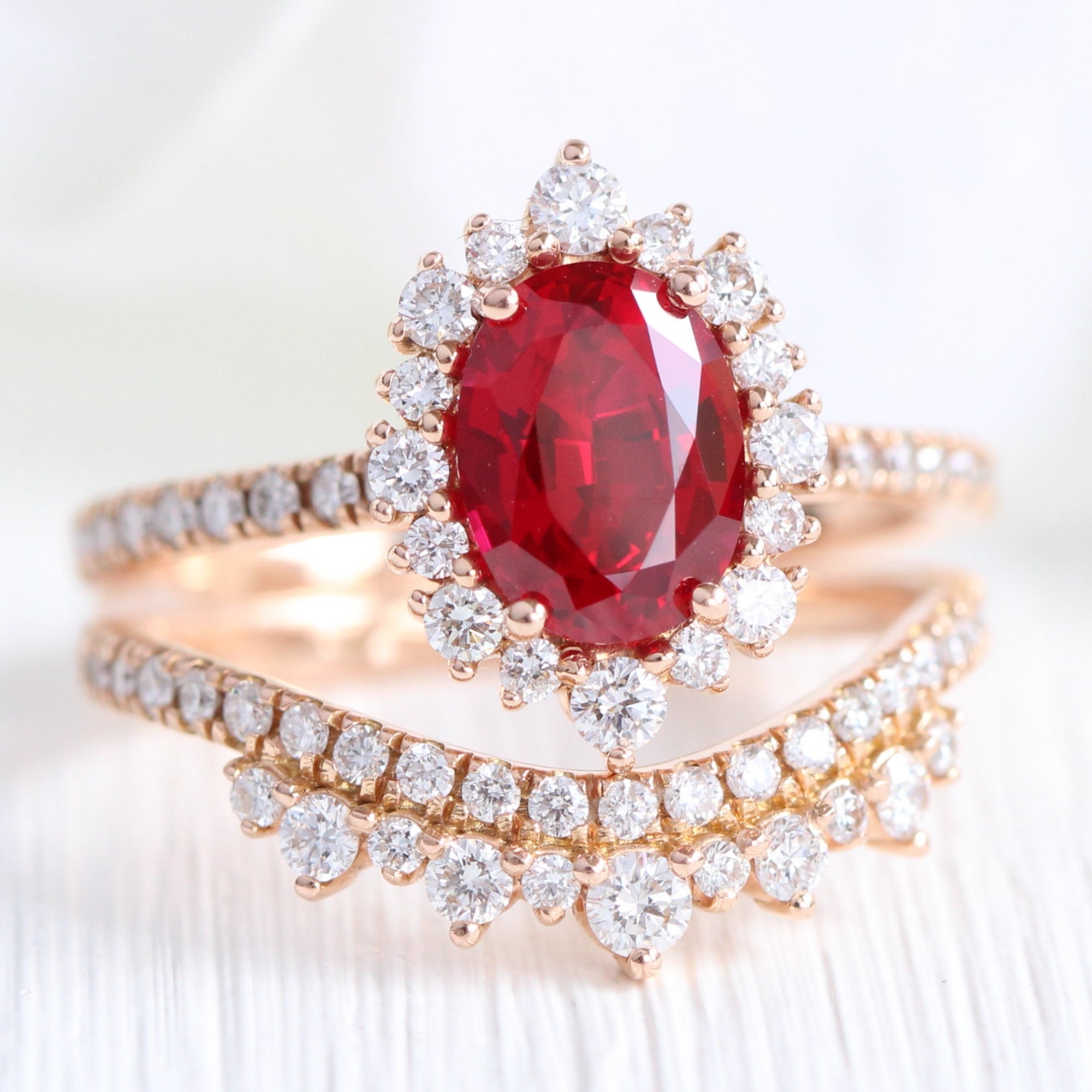 oval ruby engagement ring rose gold halo diamond bridal set and crown diamond wedding band by la more design jewelry