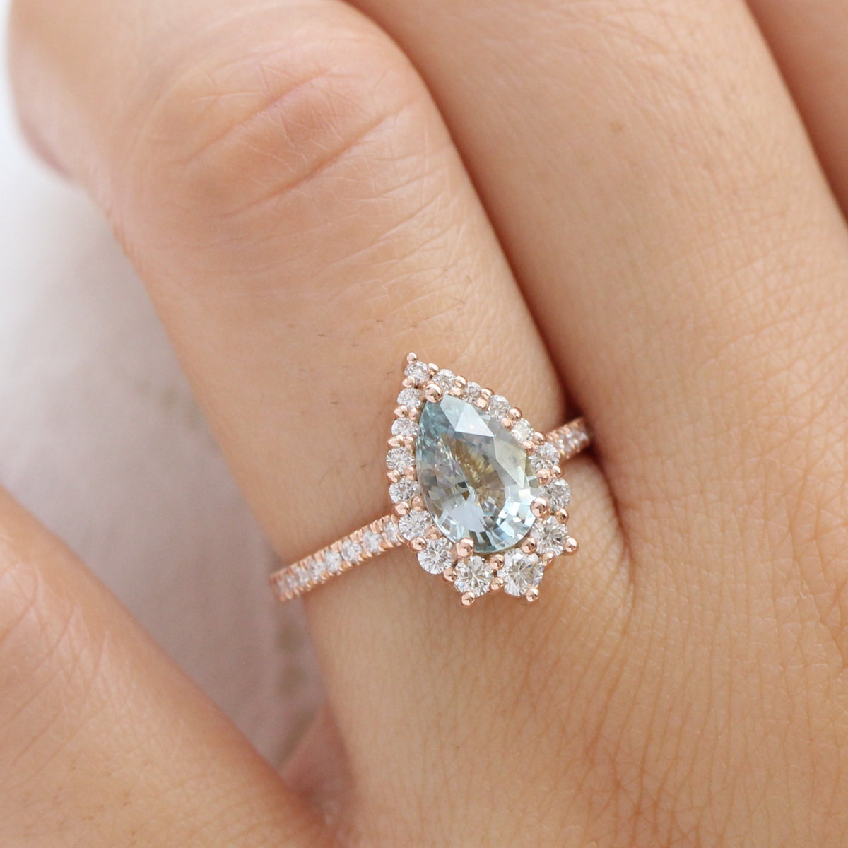 pastel blue sapphire ring rose gold halo diamond pear engagement ring la more design jewelry