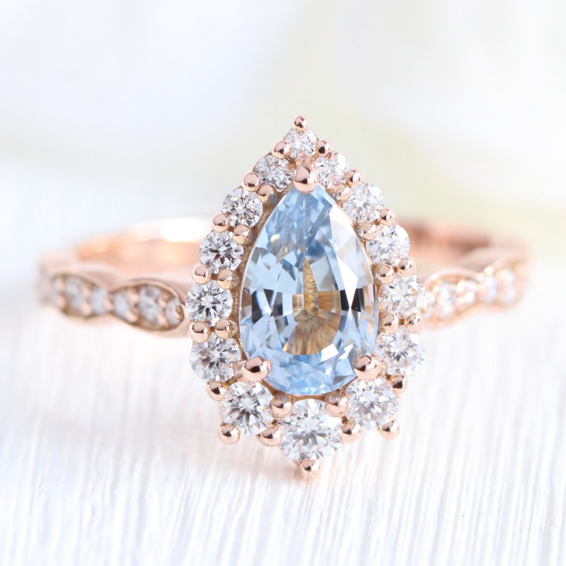 pear aqua blue sapphire ring rose gold halo diamond ring scalloped diamond band la more design jewelry