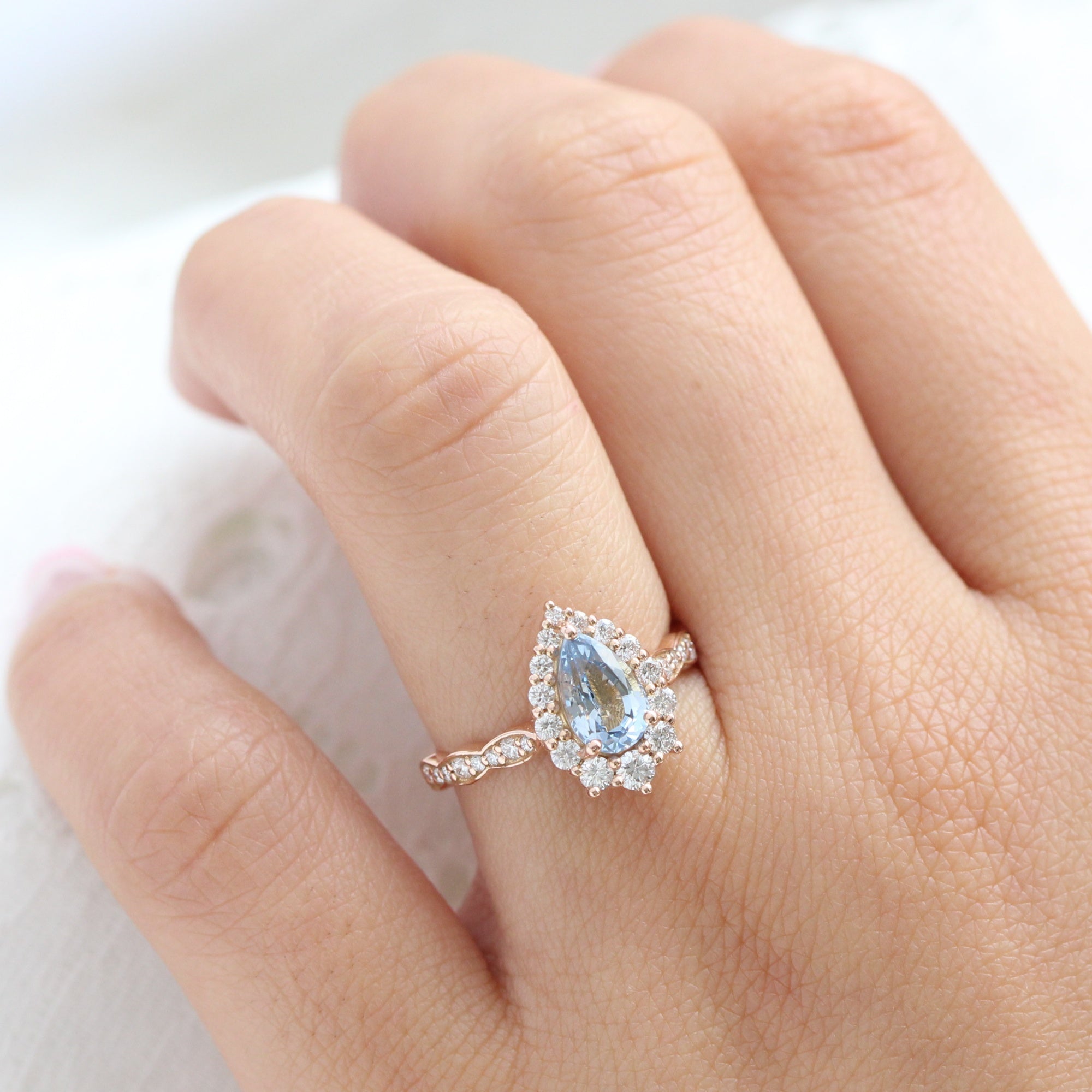 pear aqua blue sapphire ring rose gold halo diamond ring scalloped diamond band la more design jewelry