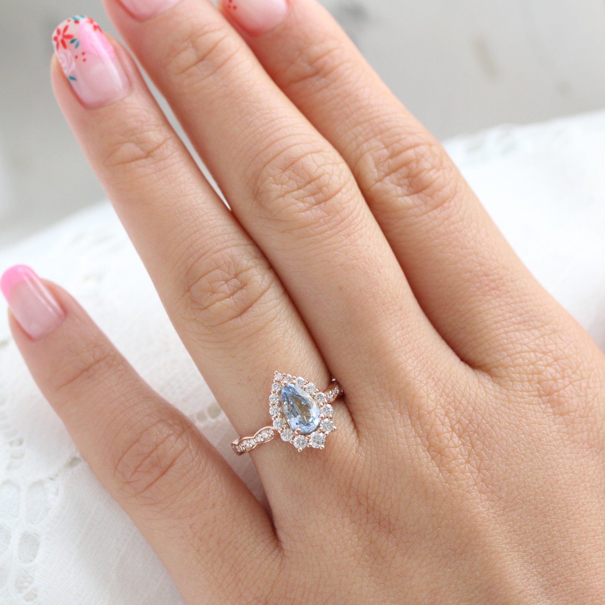 pear aqua blue sapphire ring rose gold halo diamond ring scalloped diamond band la more design jewelry