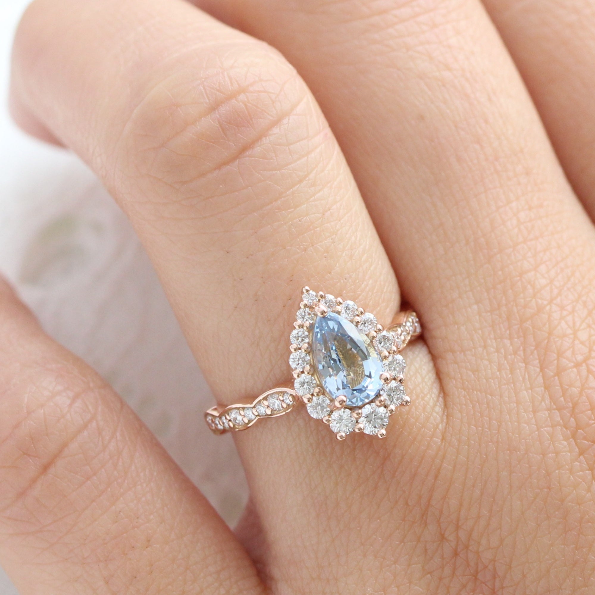 pear aqua blue sapphire ring rose gold halo diamond ring scalloped diamond band la more design jewelry