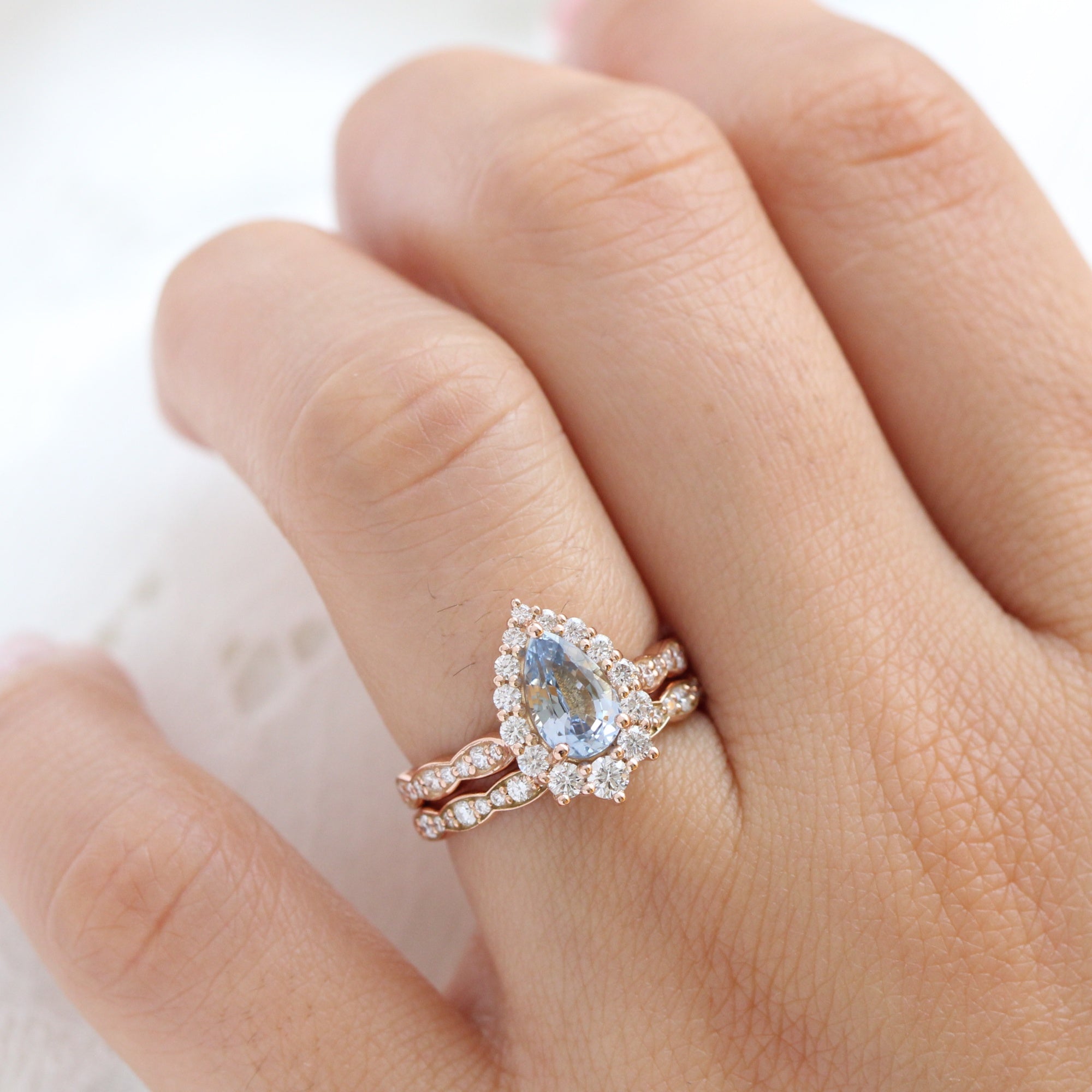 pear aqua blue sapphire ring rose gold halo diamond ring scalloped diamond band la more design jewelry