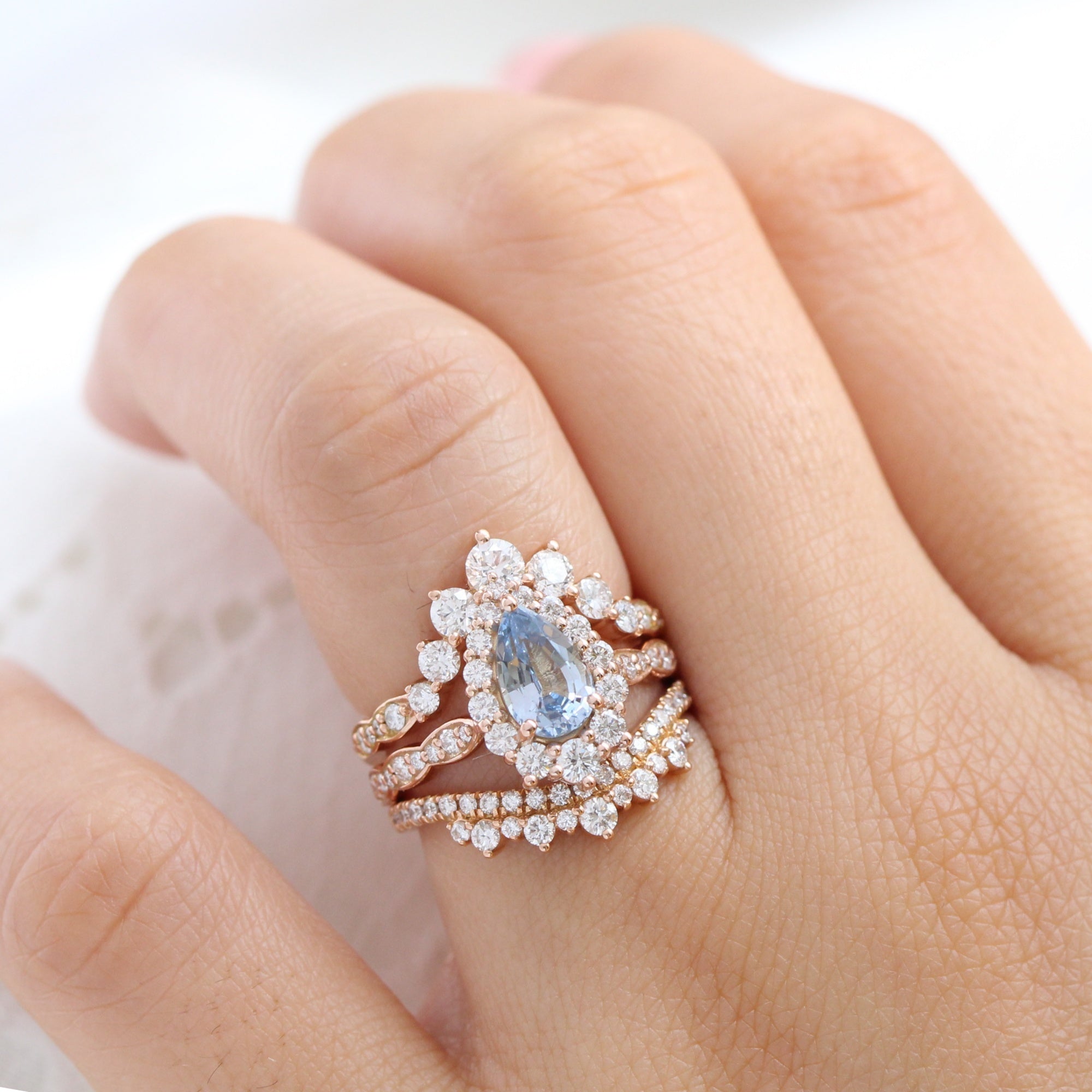 pear aqua blue sapphire ring rose gold halo diamond ring scalloped diamond band la more design jewelry