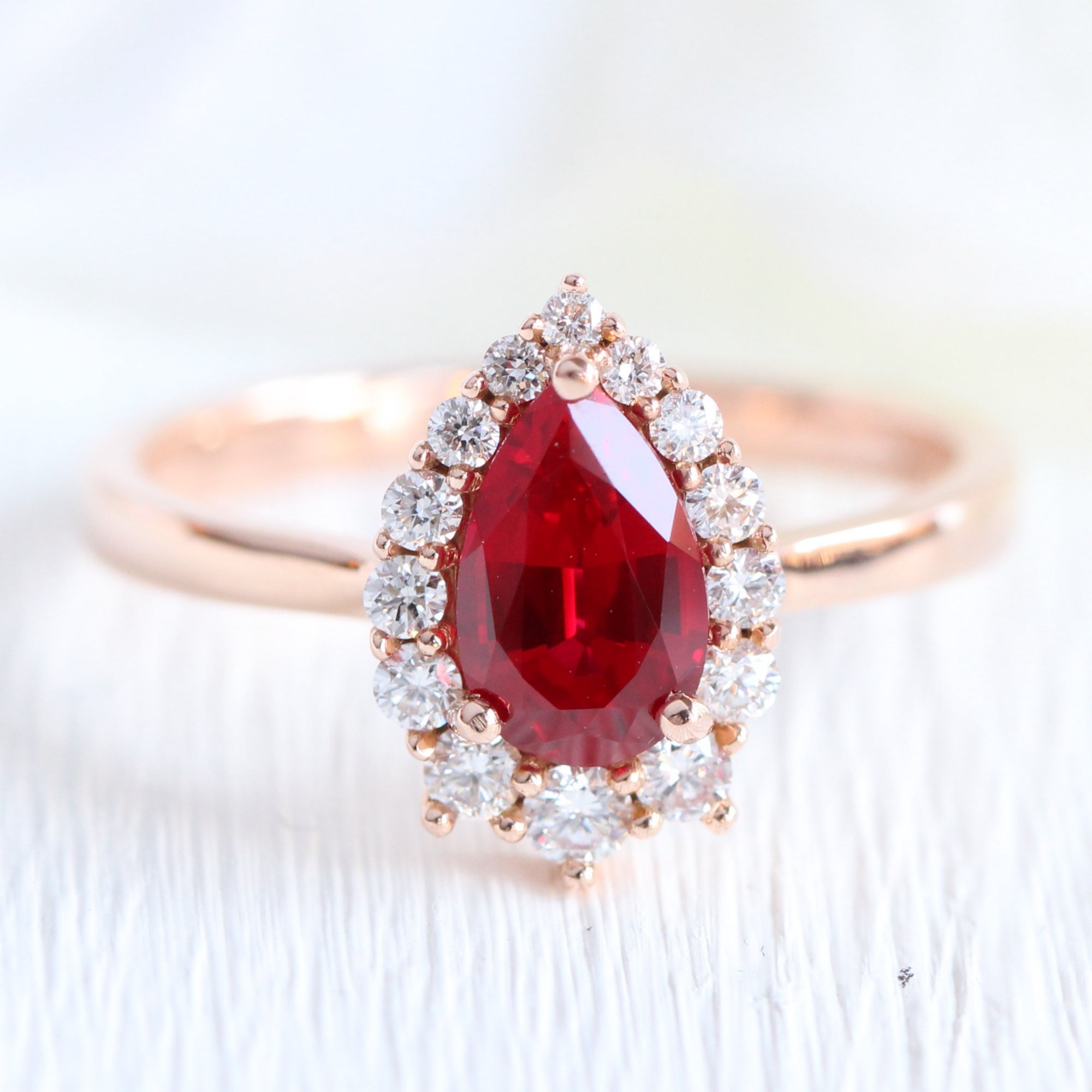 pear shaped ruby engagement ring rose gold halo diamond cluster ring la more design jewelry