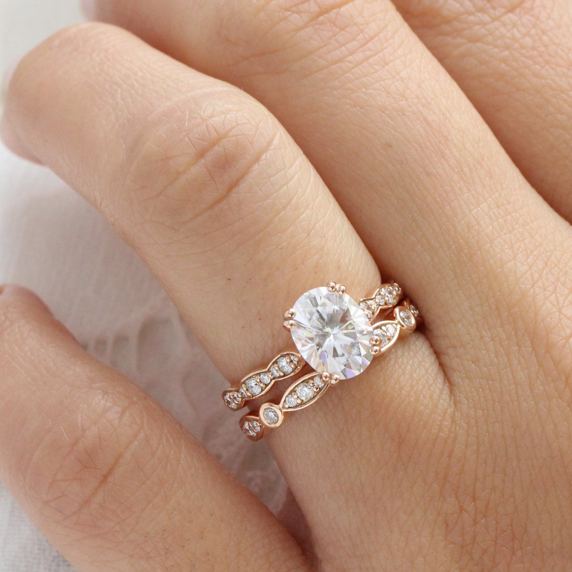 solitaire moissanite ring bridal set in rose gold bezel diamond band by la more design