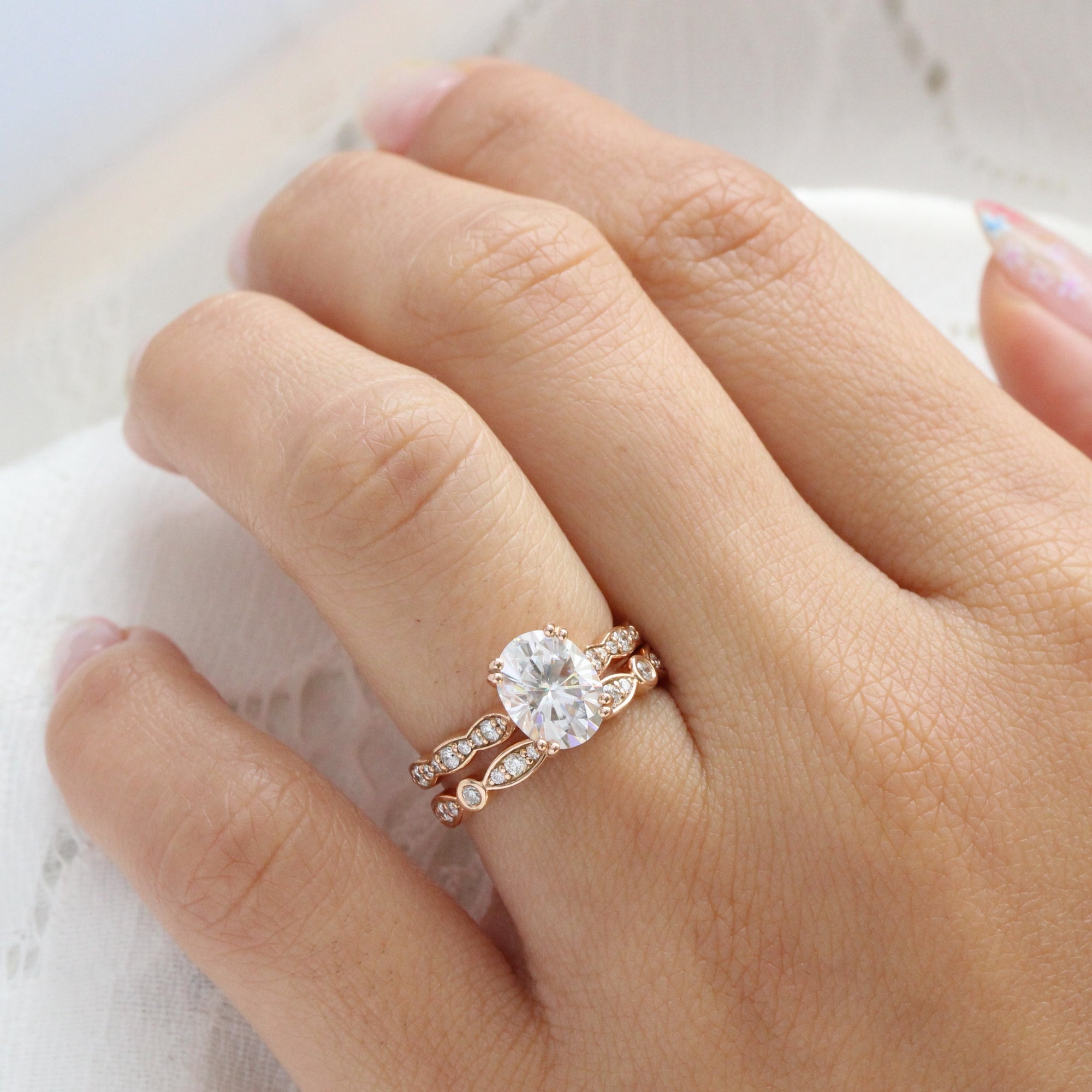 solitaire moissanite ring bridal set in rose gold bezel diamond band by la more design