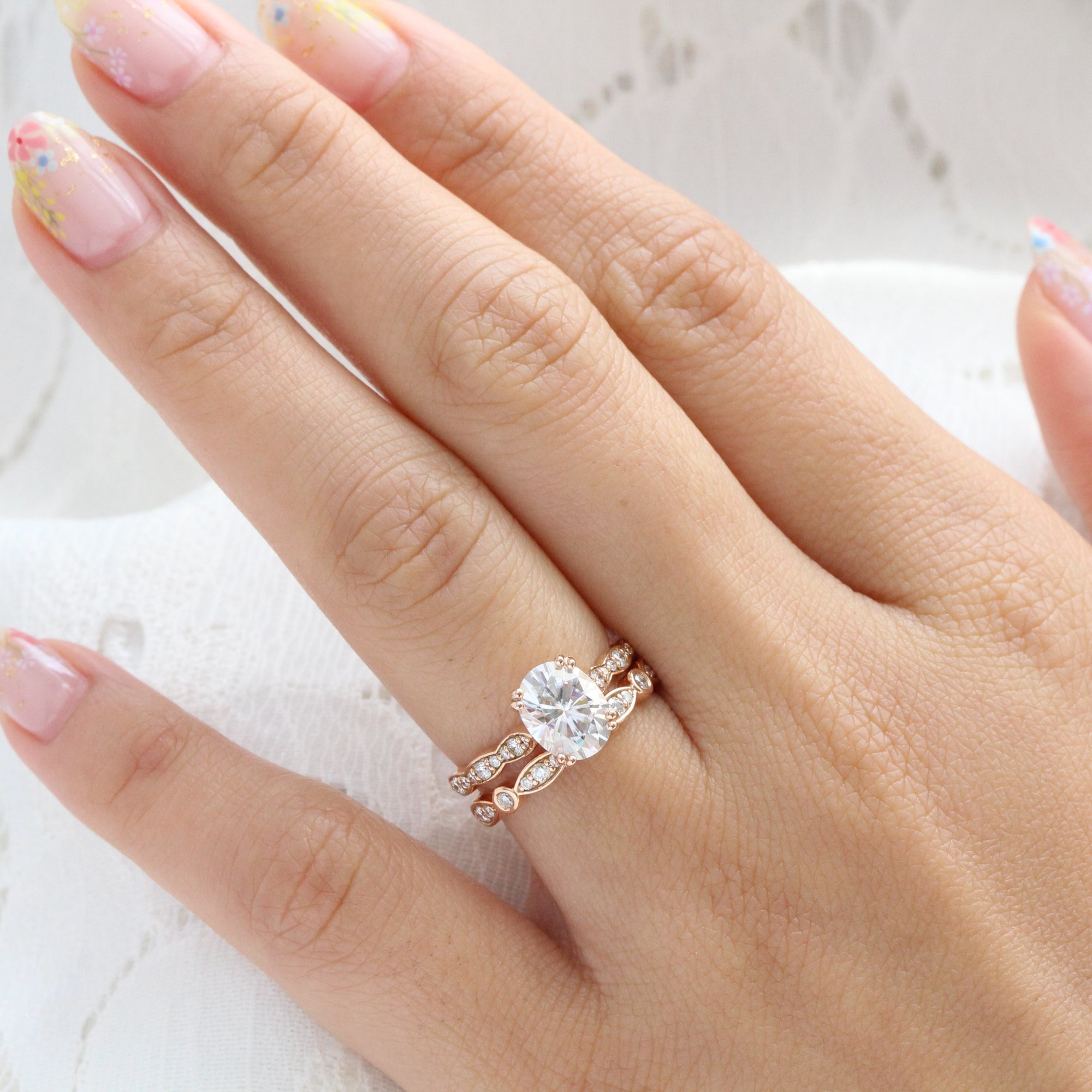 solitaire moissanite ring bridal set in rose gold bezel diamond band by la more design